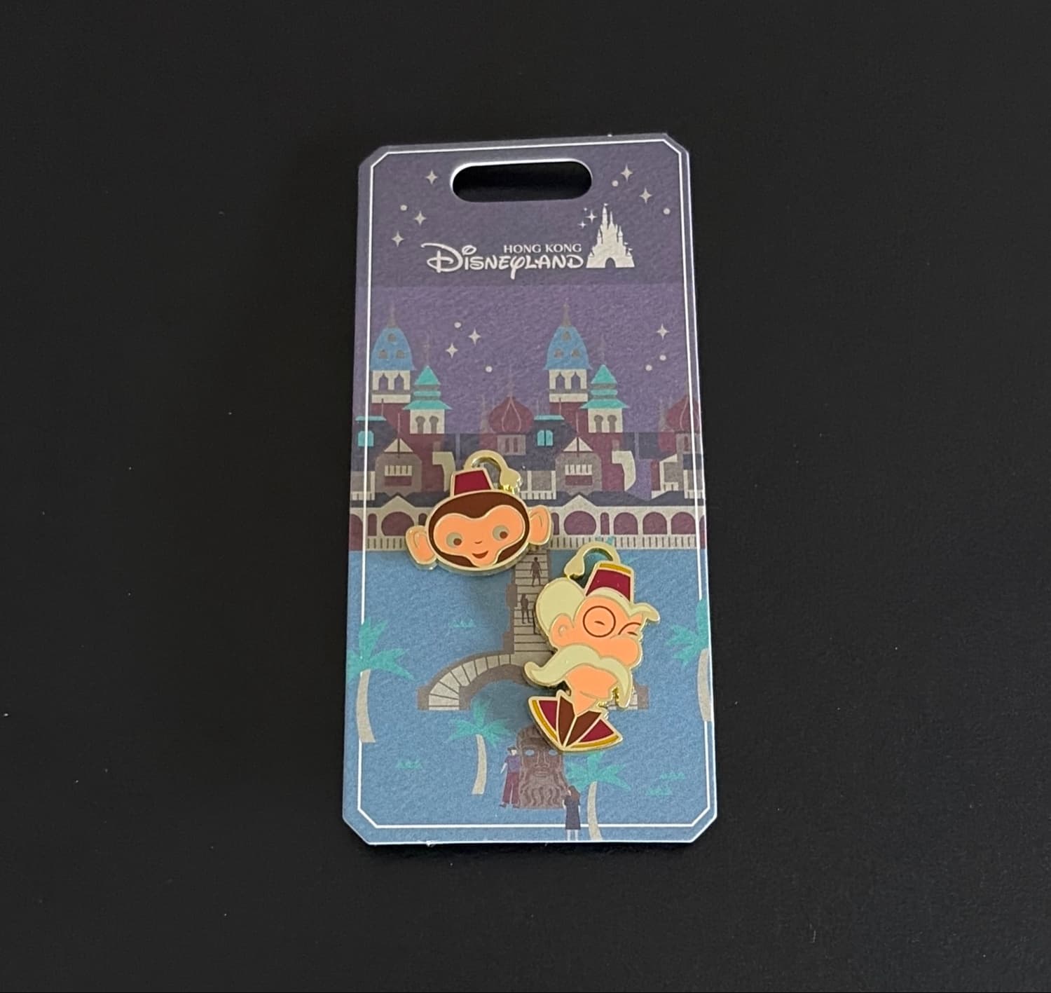 It's a Small World Monkey and Man with Fez Pin Set front