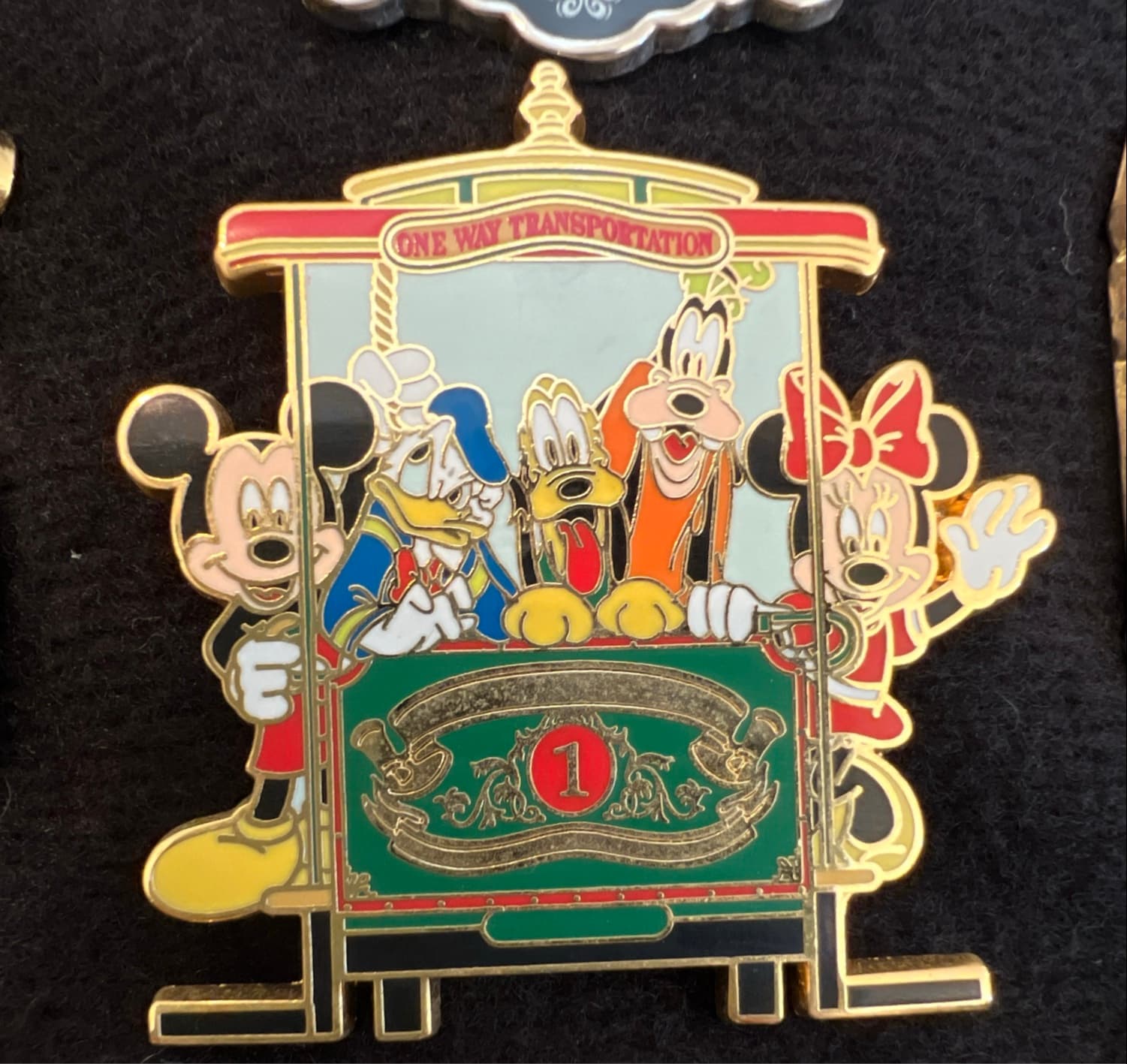 Mickey, Minnie, Donald, Pluto and Goofy one way transportation trolley front