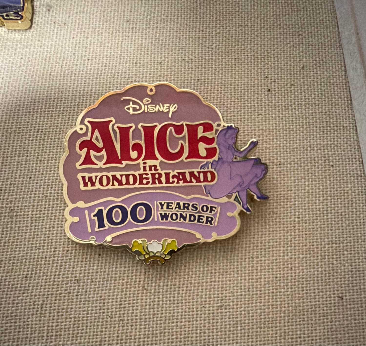 Disney 100 Alice in Wonderland Logo Enamel Pin front