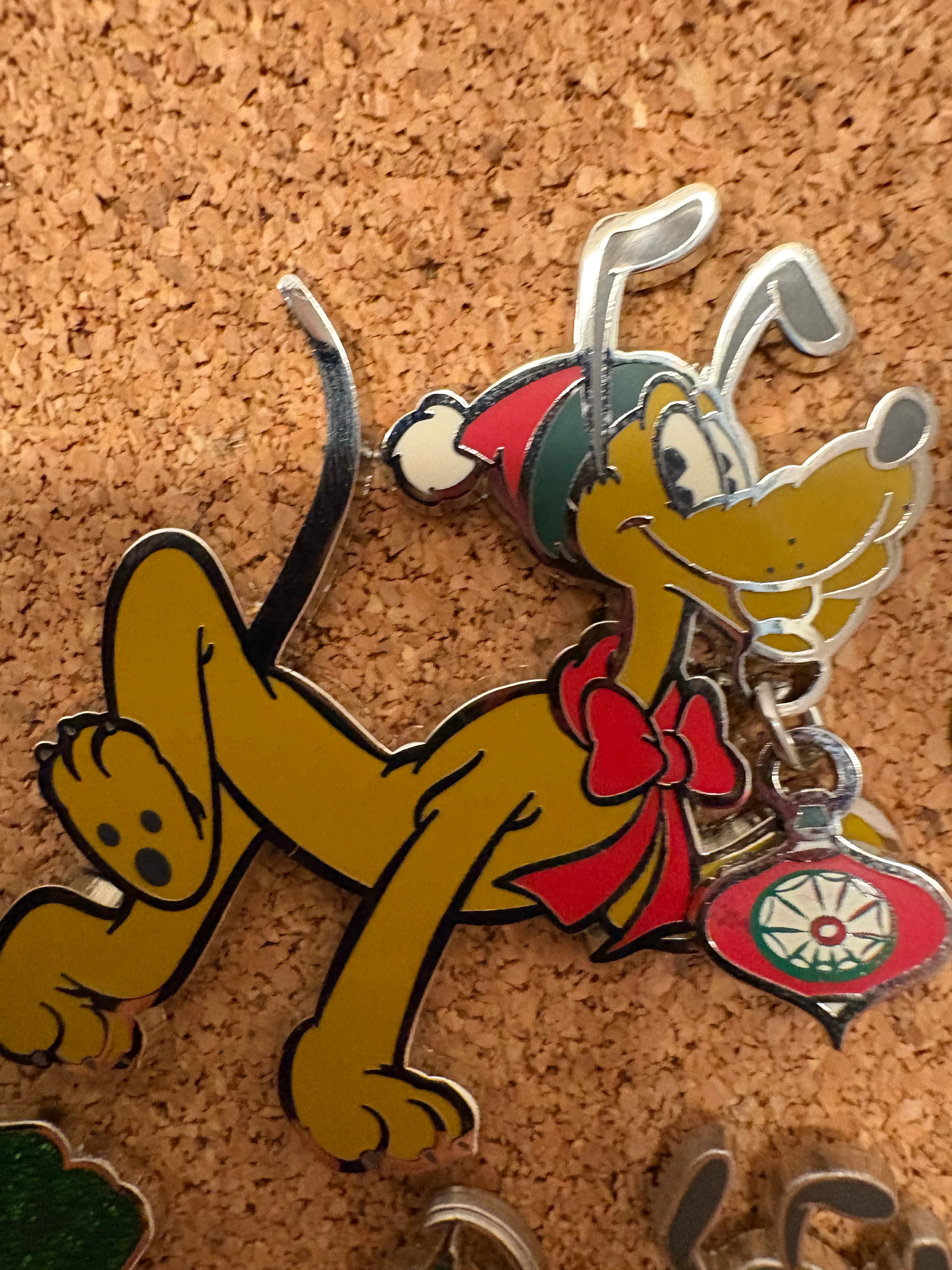 Pluto with Christmas Ornament and Santa Hat front