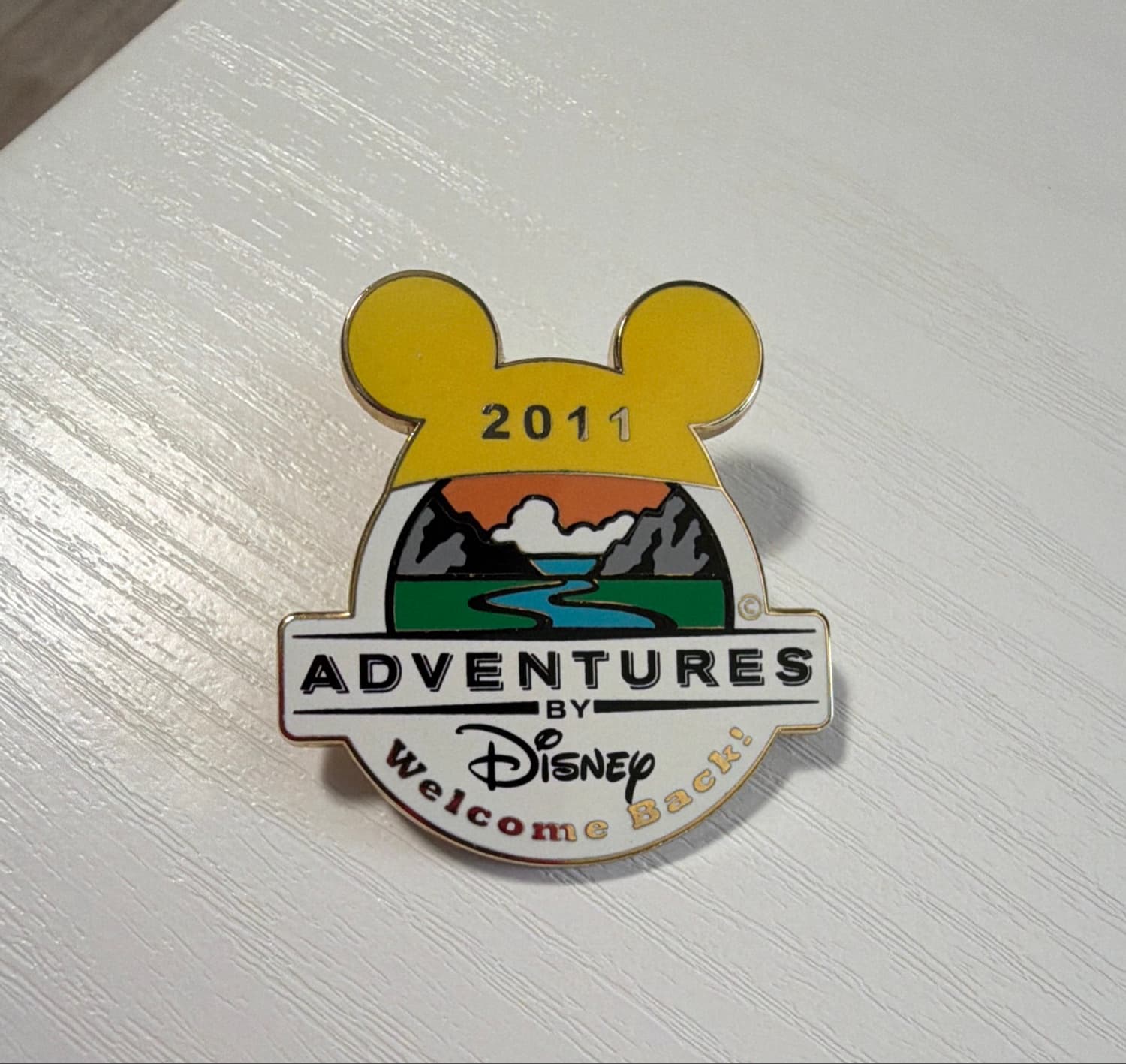 Adventures by Disney 2011 Welcome Back Return Adventurer Pin front