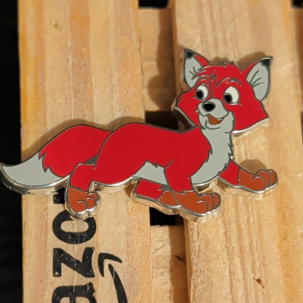 Tod Lying Down Smiling - The Fox and The Hound front