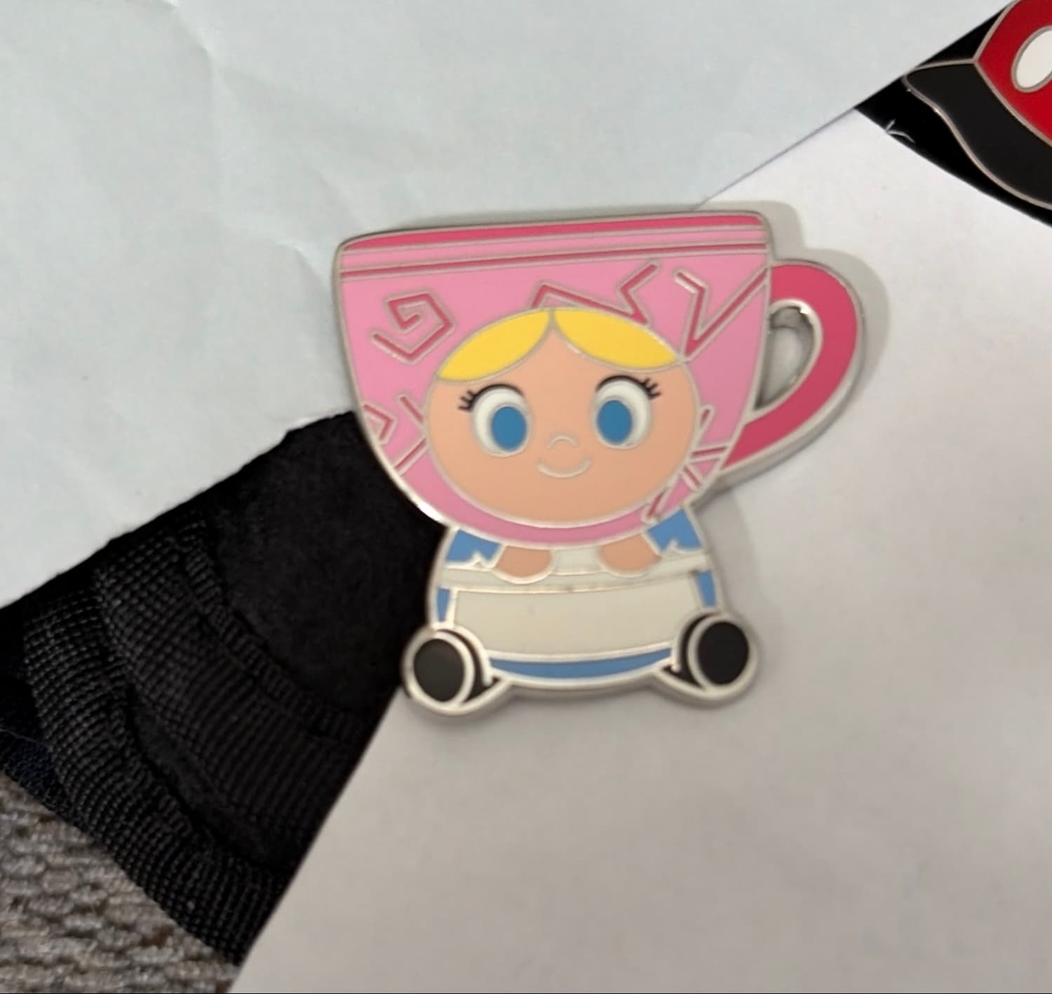 Alice in a Pink Sparkle Tea Cup pin front