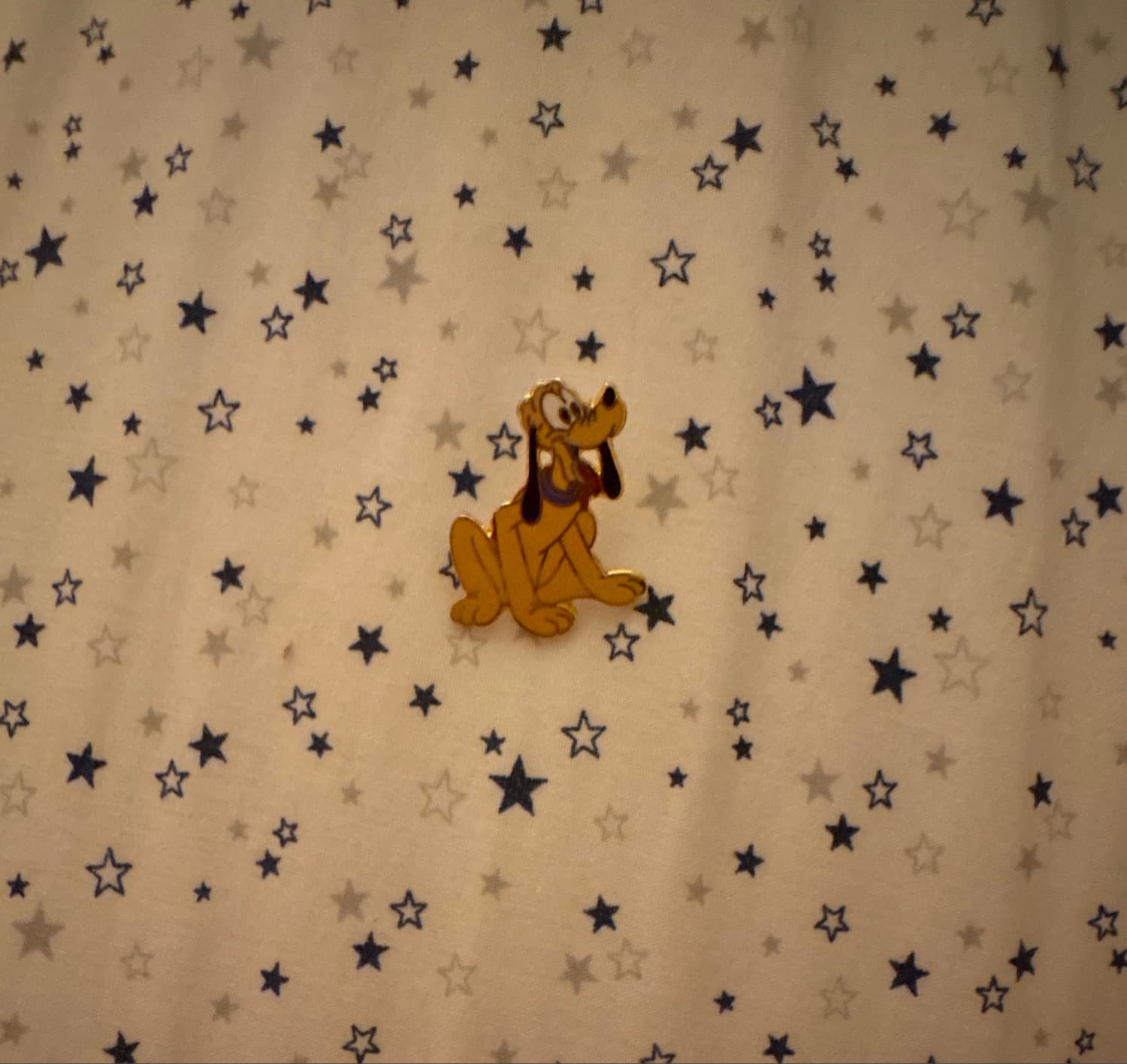 Pluto Sitting with Tongue Out and Purple Collar front