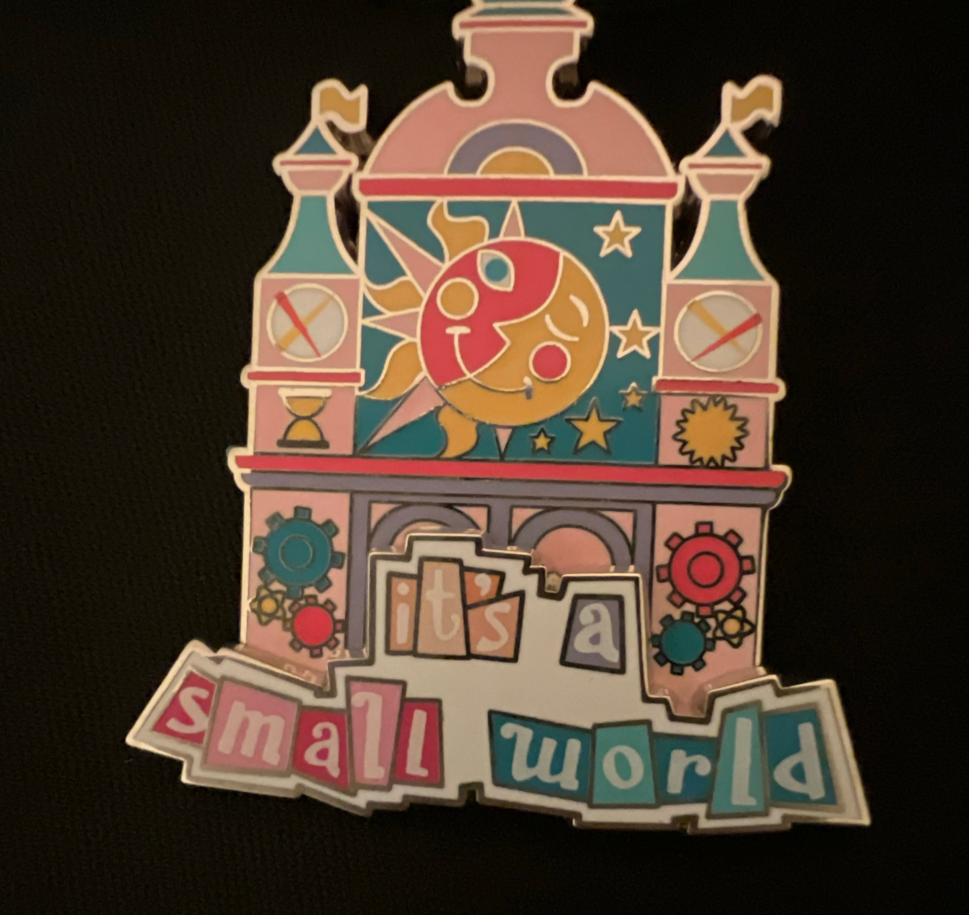 it's a small world Moon and Sun Clock Tower Pin front