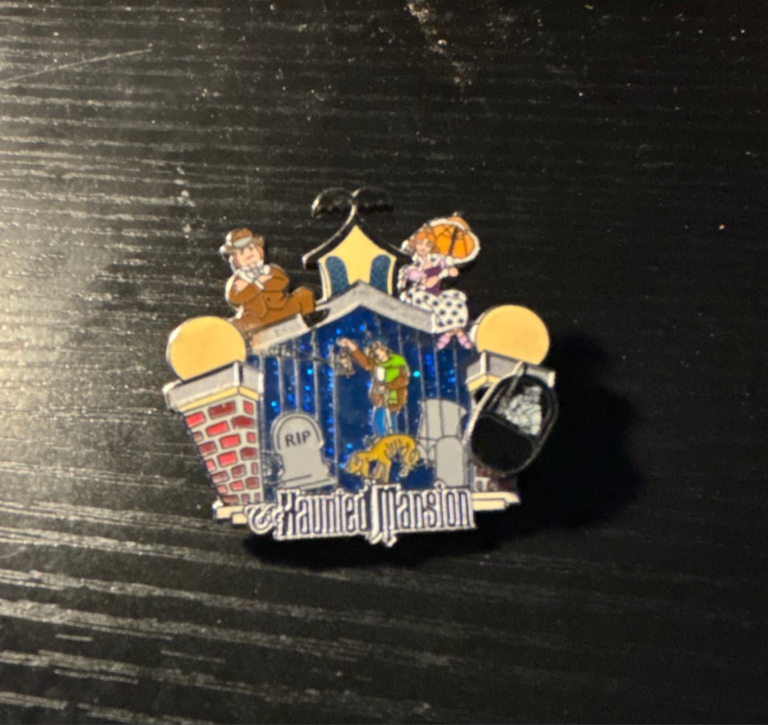 Haunted Mansion Memorable Scenes Pin with Stretching Room Characters and Caretaker front