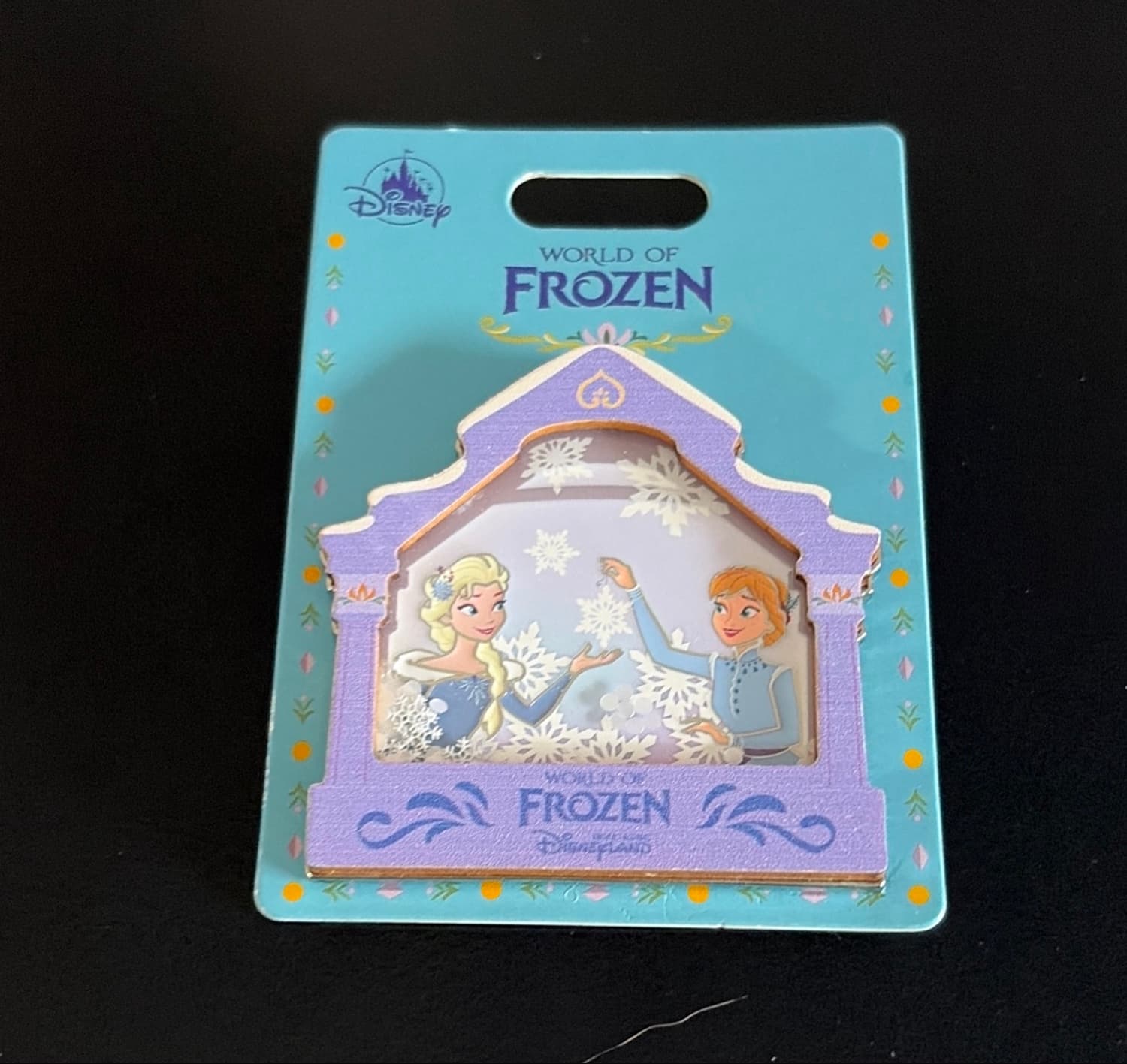 Elsa and Anna World of Frozen Disneyland Pin front