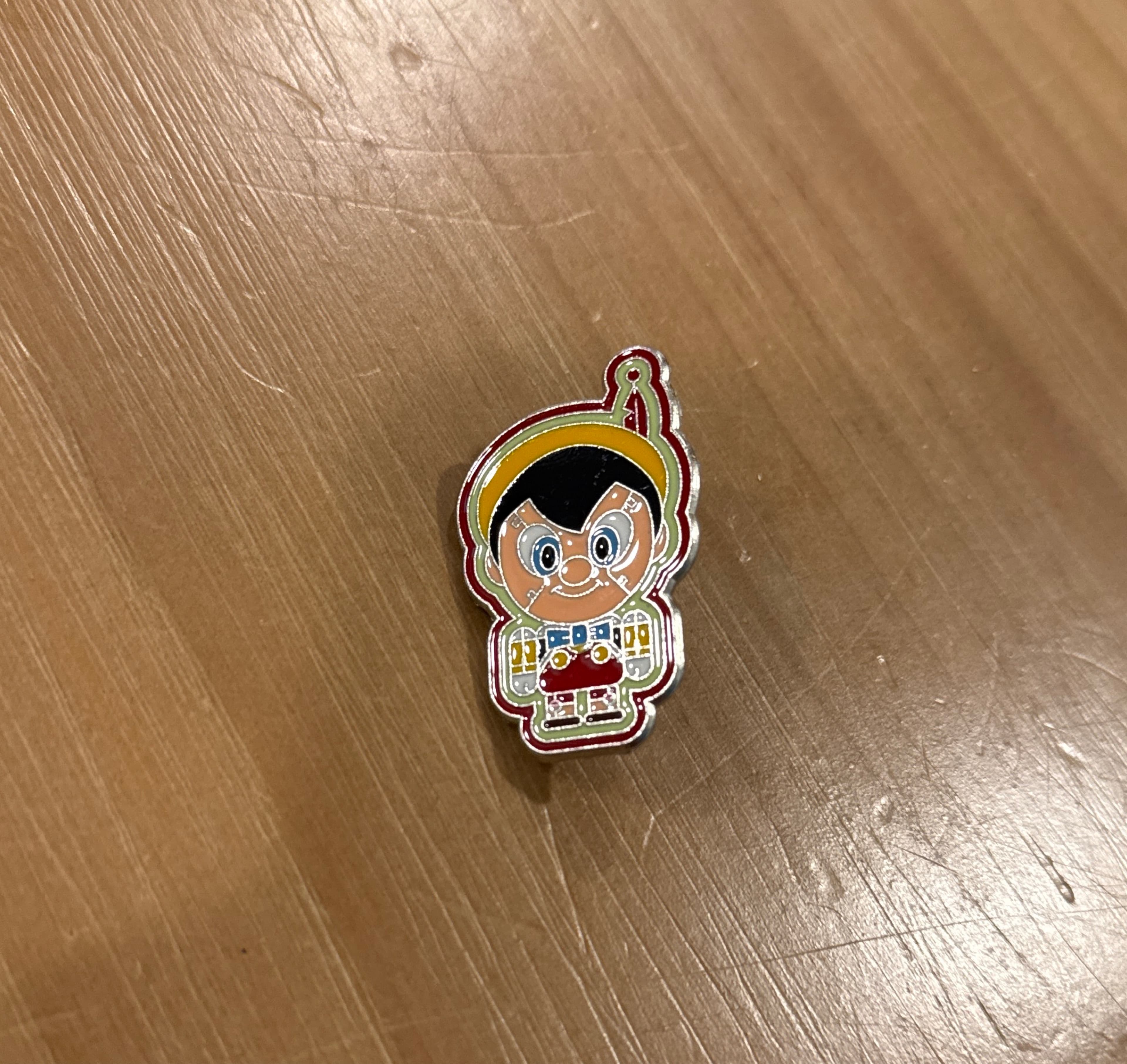 Pinocchio Robot Toy Factory Pin front