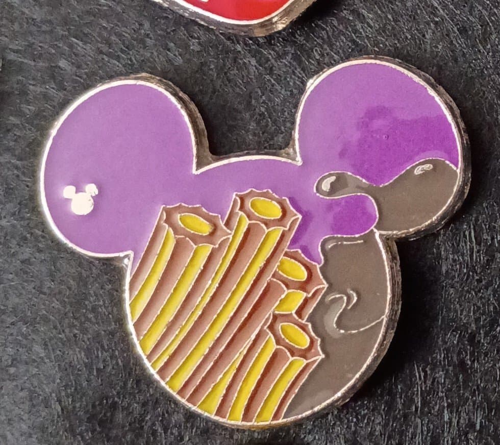 Mickey Mouse icon head, with churros and chocolate sauce front