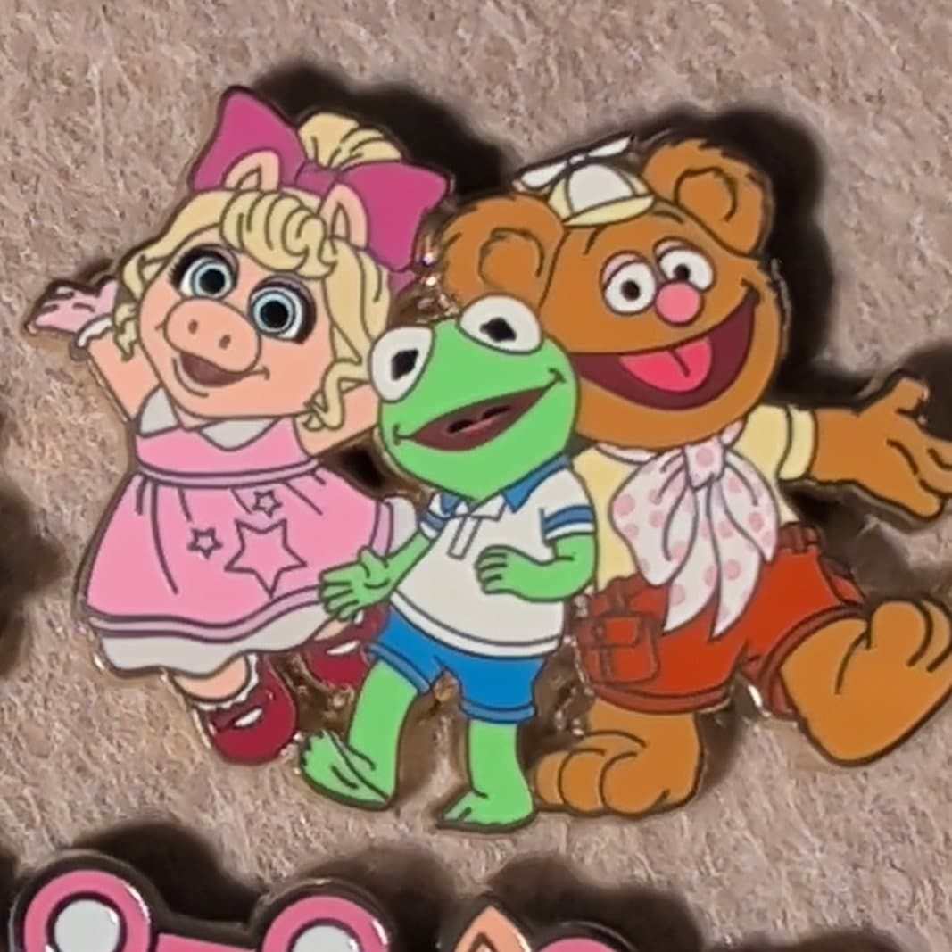 Kermit, Fozzie Bear and Miss Piggy front