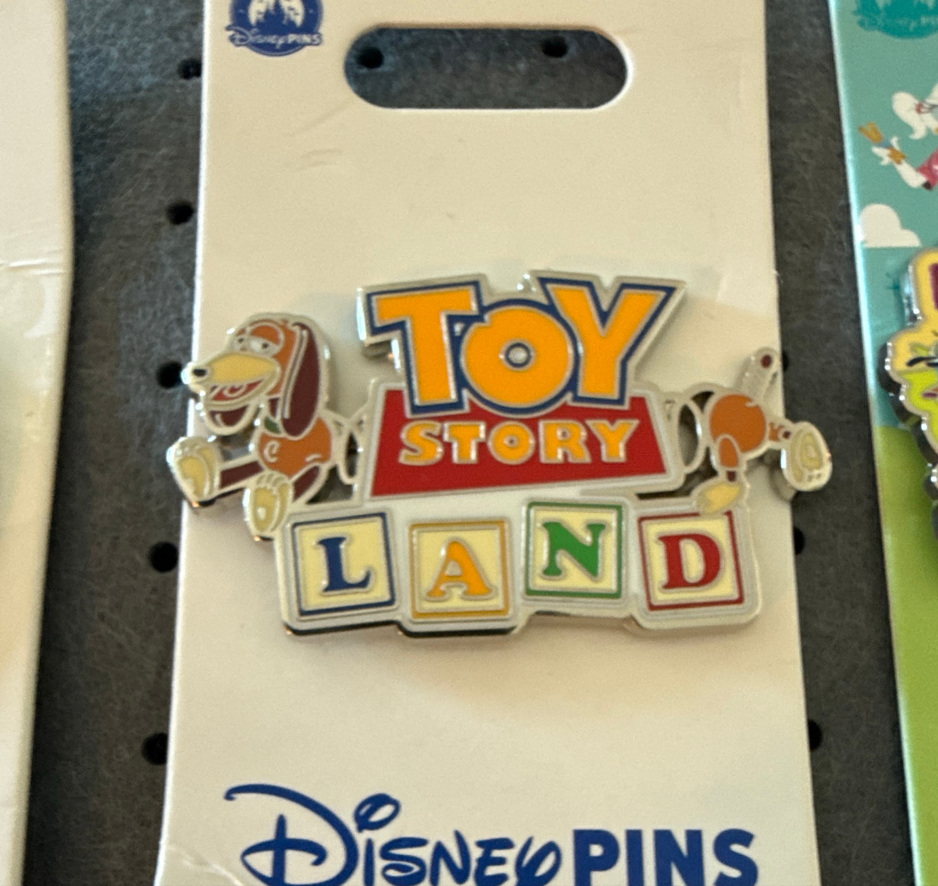 Slinky Dog Toy Story Land Logo Pin front