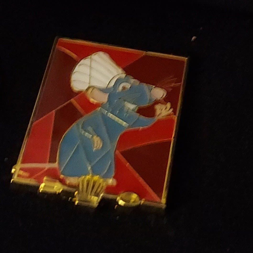 Loungefly Disney Pixar Characters Sustained Portraits Blind Box Pin Set - Remy Pin front