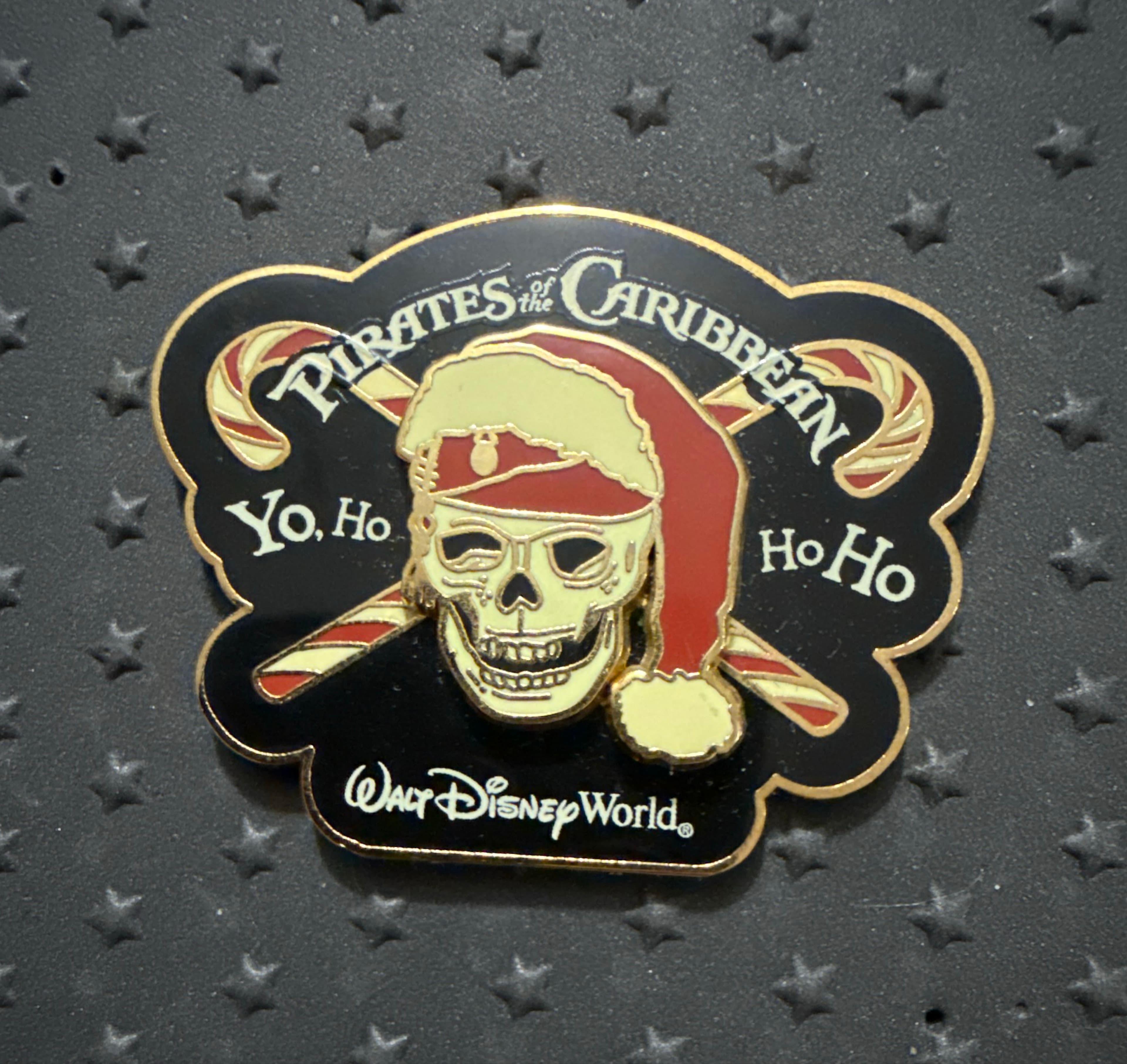 Pirates of the Caribbean Christmas Yo, Ho Ho Ho Skull with Santa Hat and Candy Canes Walt Disney World Pin front