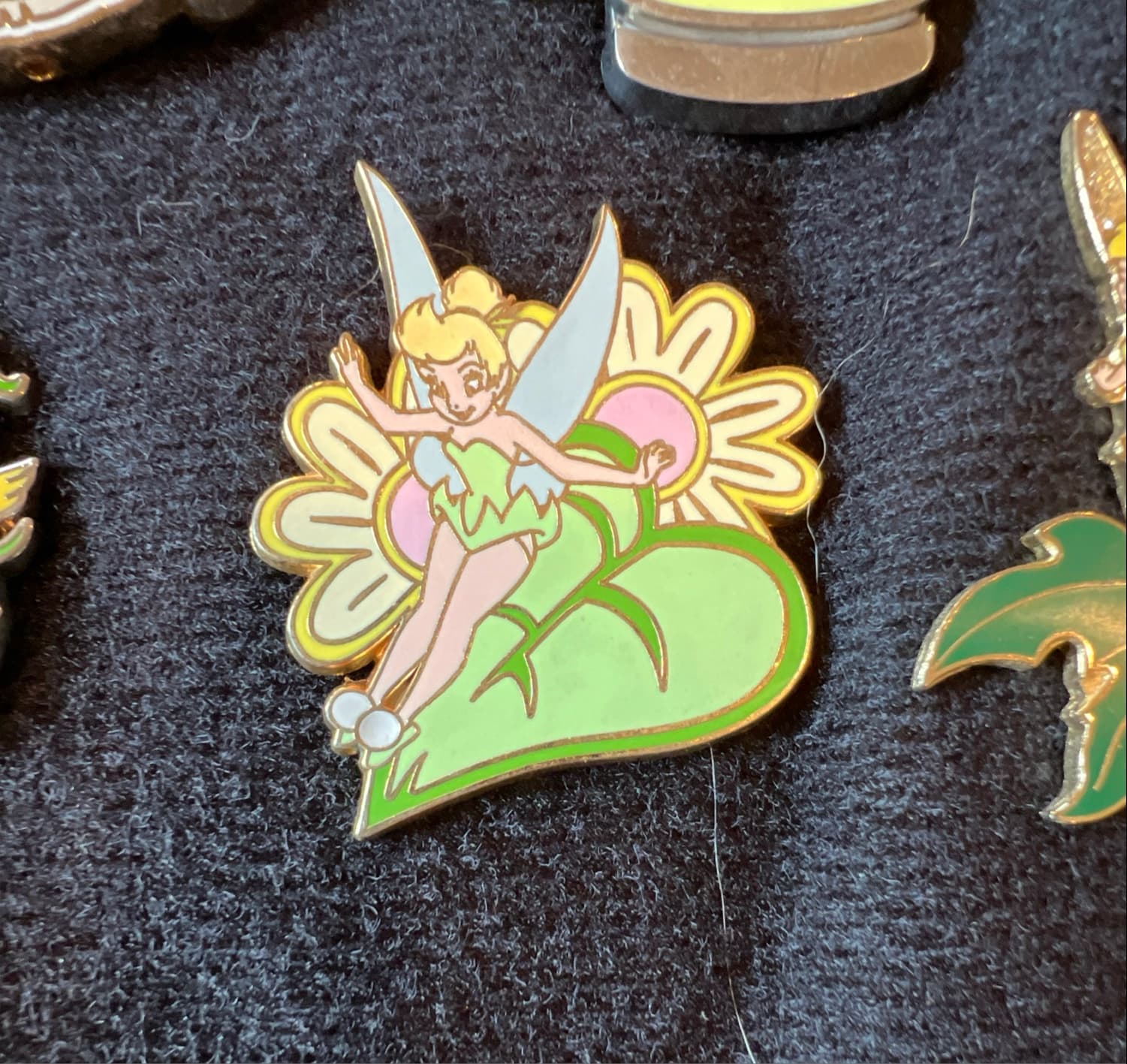 Tinker Bell Sitting on the Leaf of a Pink Flower front