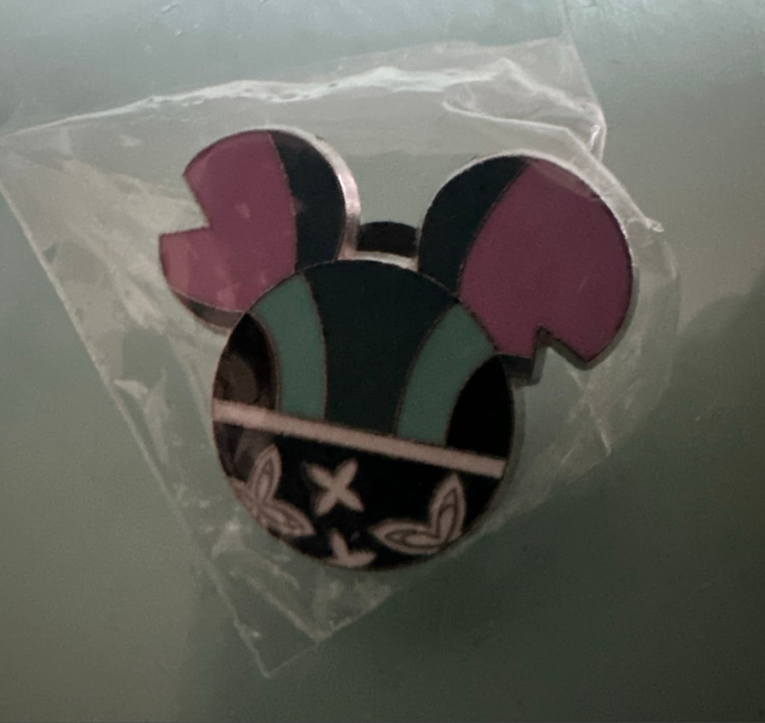 Mickey Head Icon - Pink, Teal, Black with X and Leaf Pattern front