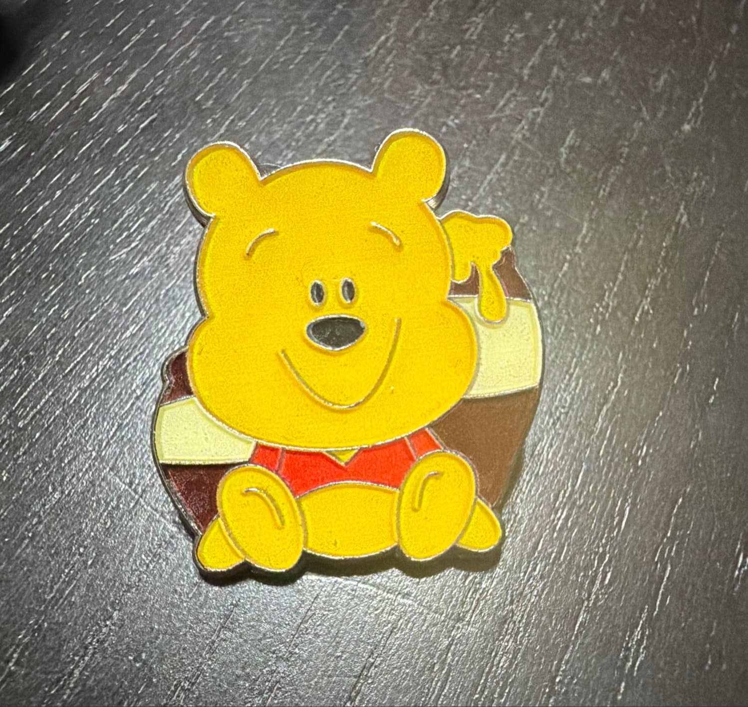 Winnie the Pooh - Pooh Sitting and Eating Honey (Hunny) front