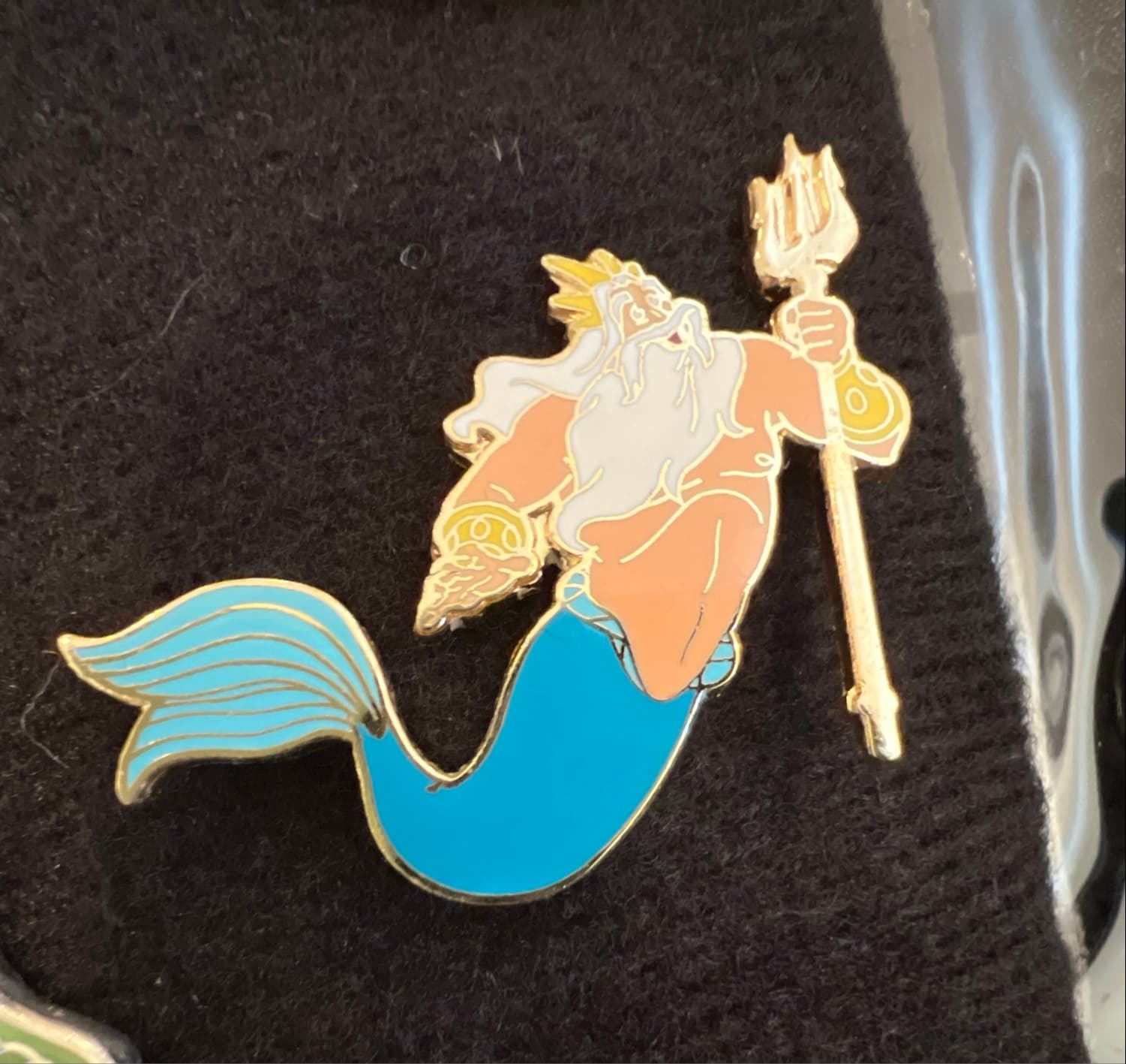King Triton Holding Up His Trident front