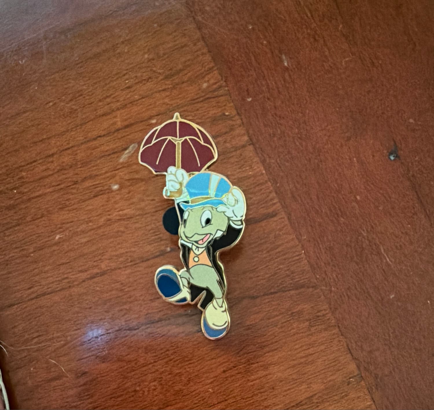 Jiminy Cricket with Red Umbrella Holding Hat front