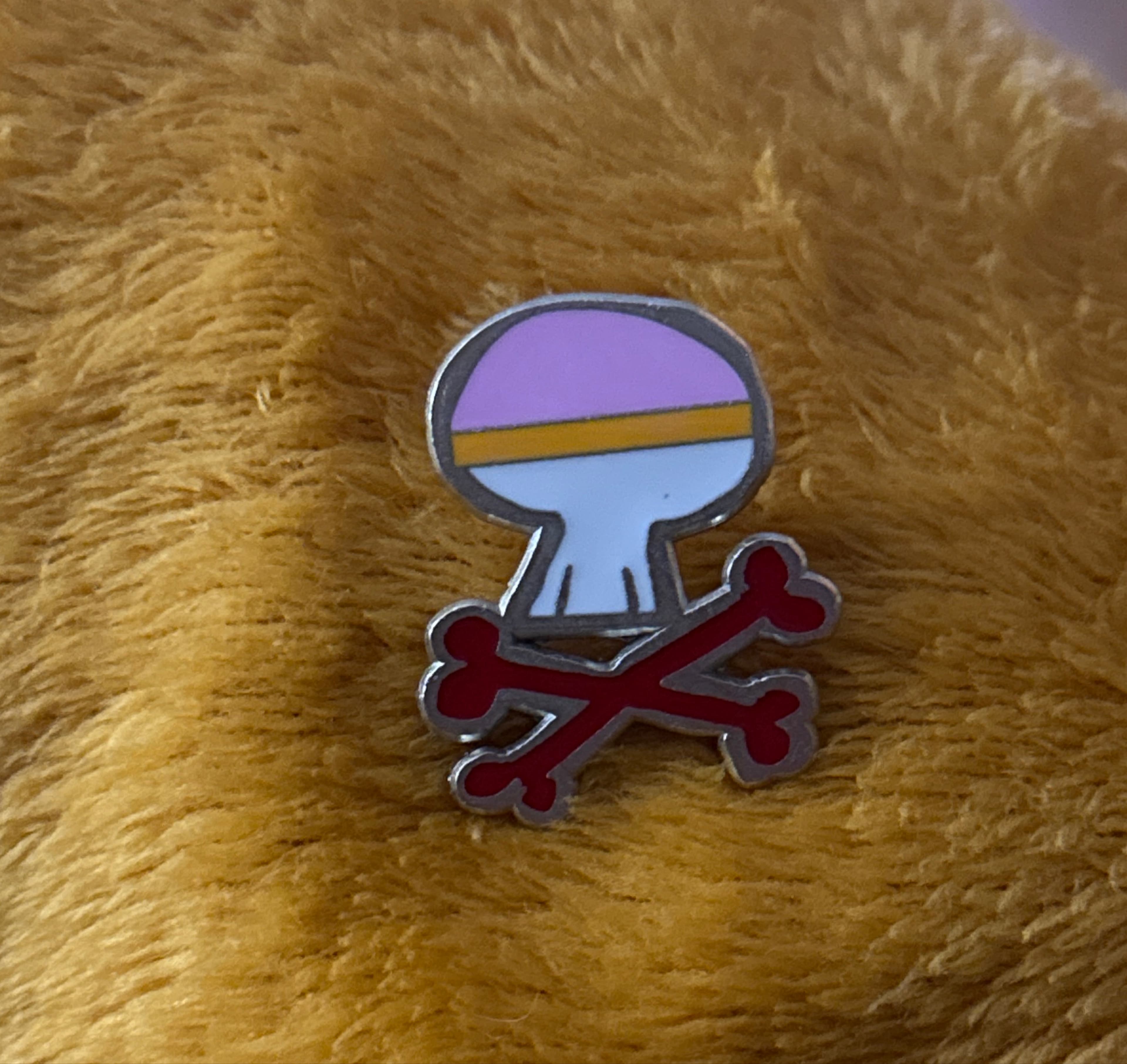 Daisy Duck Skull Crossbones Pin front