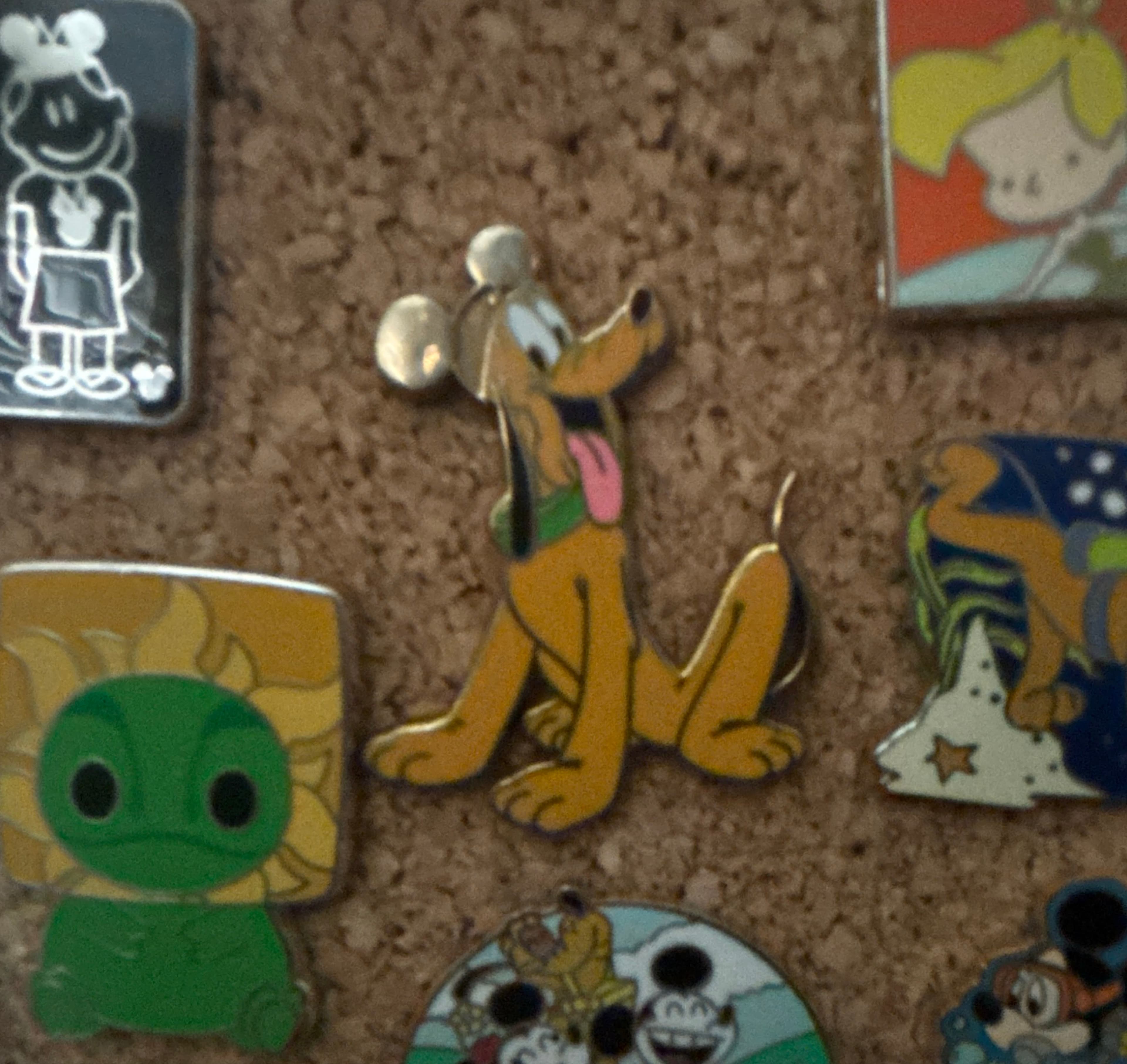 Pluto Sitting with Left Ear Up front