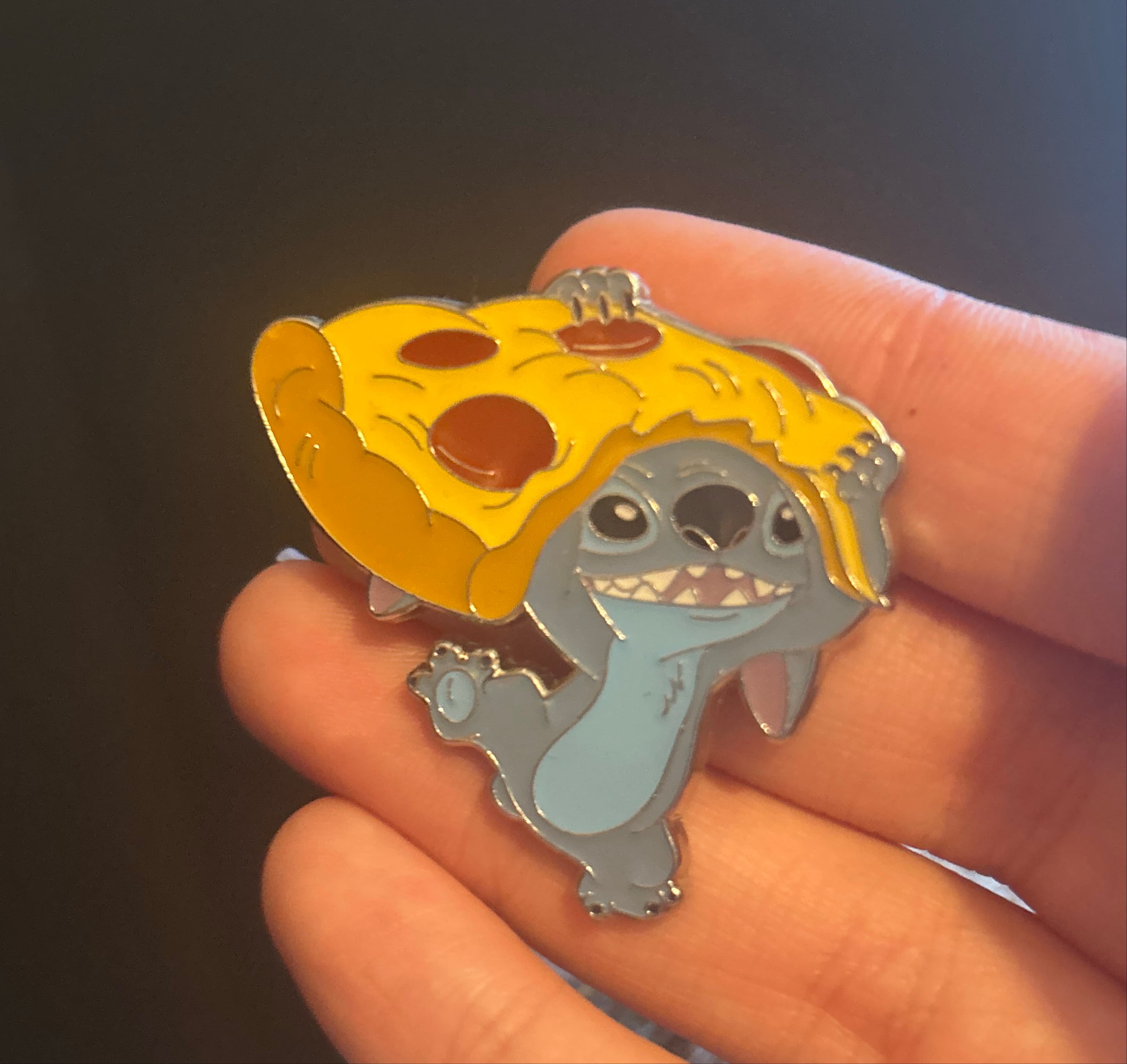 Stitch holding pizza front