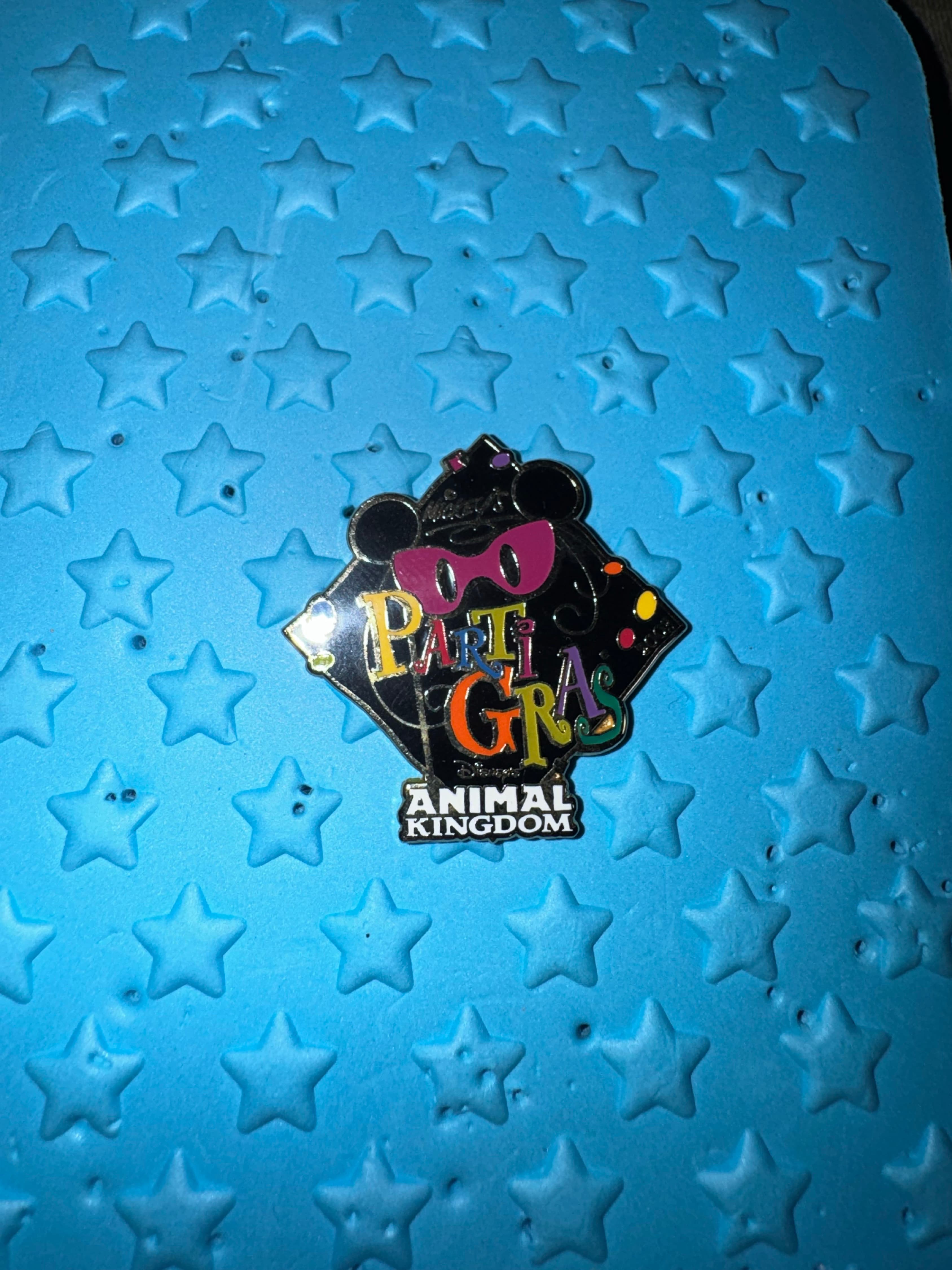 Mickey's Parti Gras Logo Animal Kingdom front