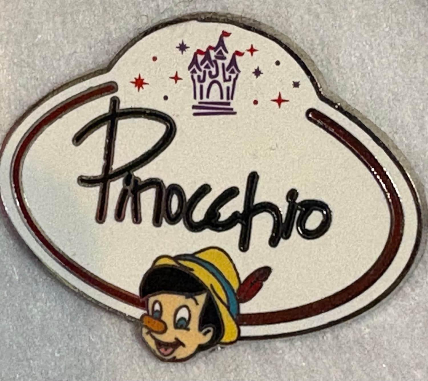 Pinocchio Cast Member Name Tag Signature Pin front