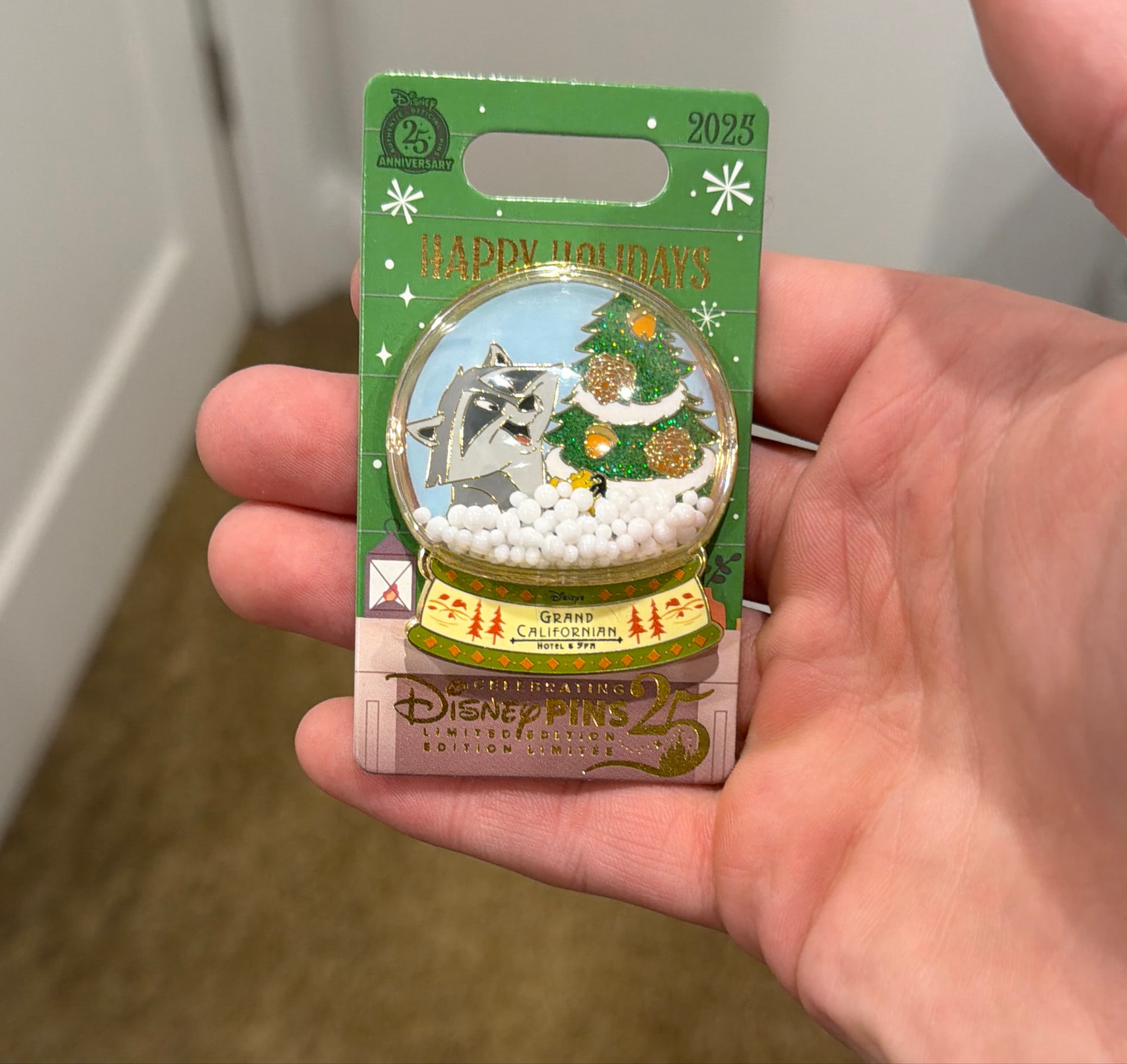 Happy Holidays Grand Californian Hotel Meeko Snow Globe Pin front