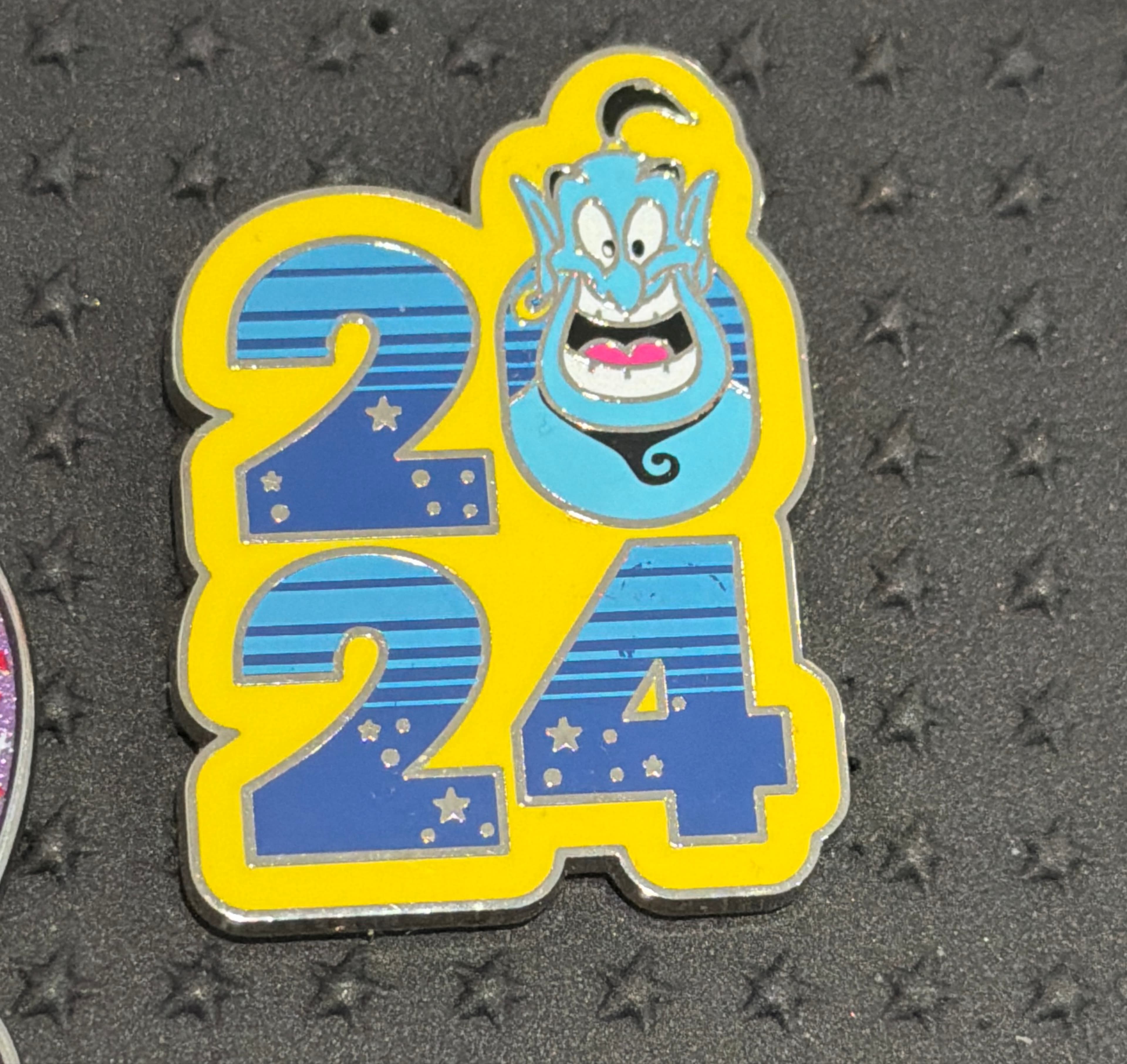 Genie 2024 Dated Character Booster Pin front