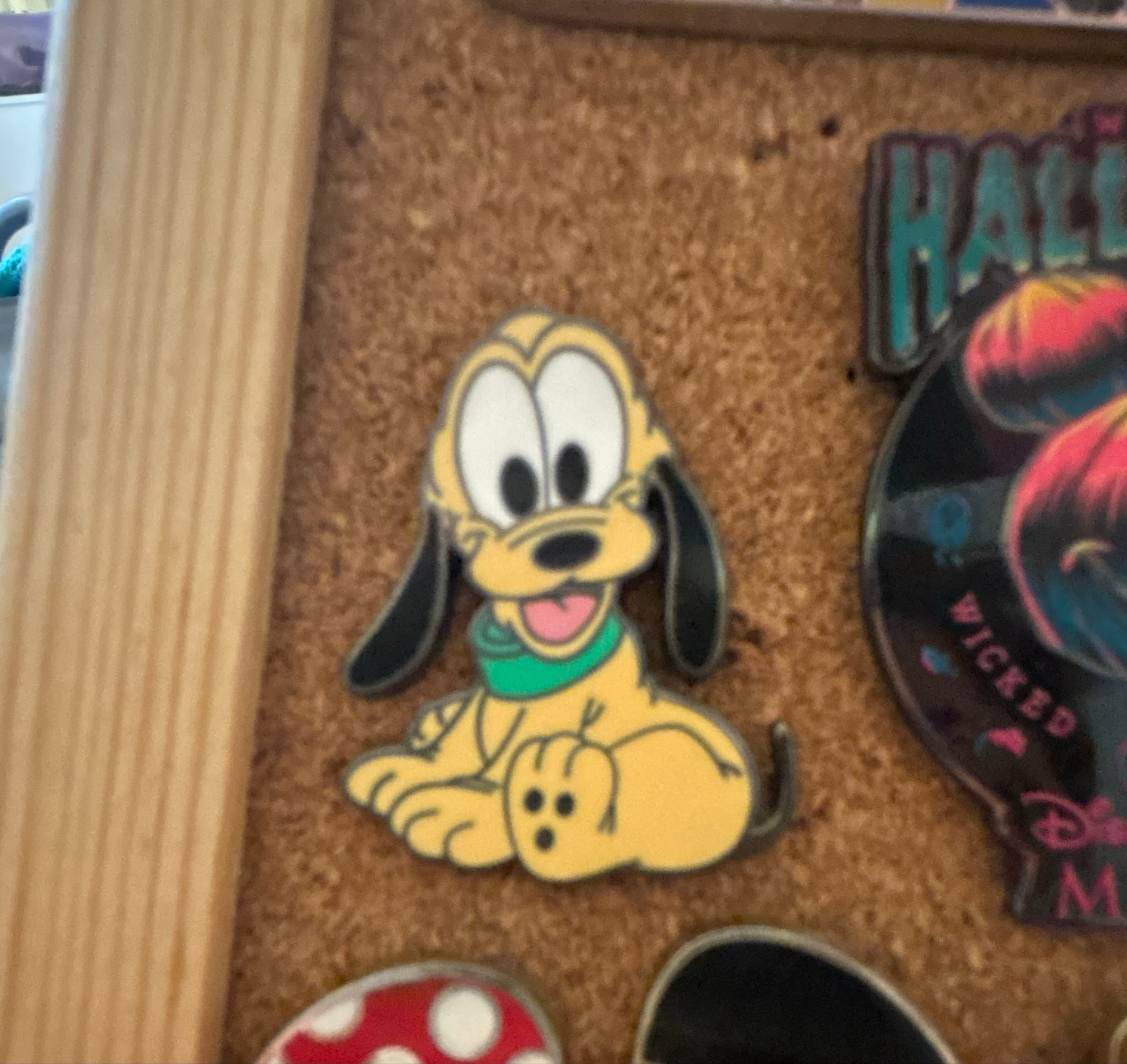 Pluto Sitting - Facing Right with Green Collar front