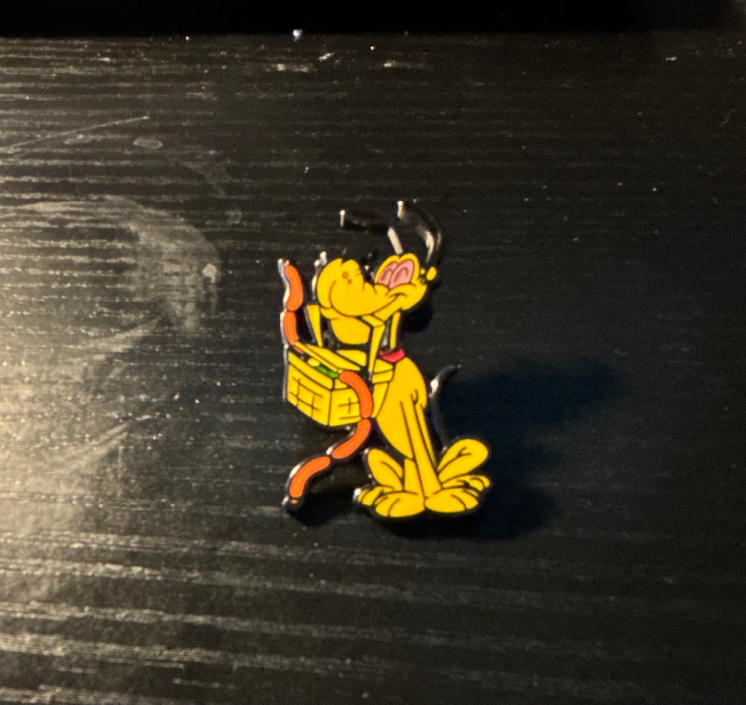 Pluto With a Basket in His Mouth front