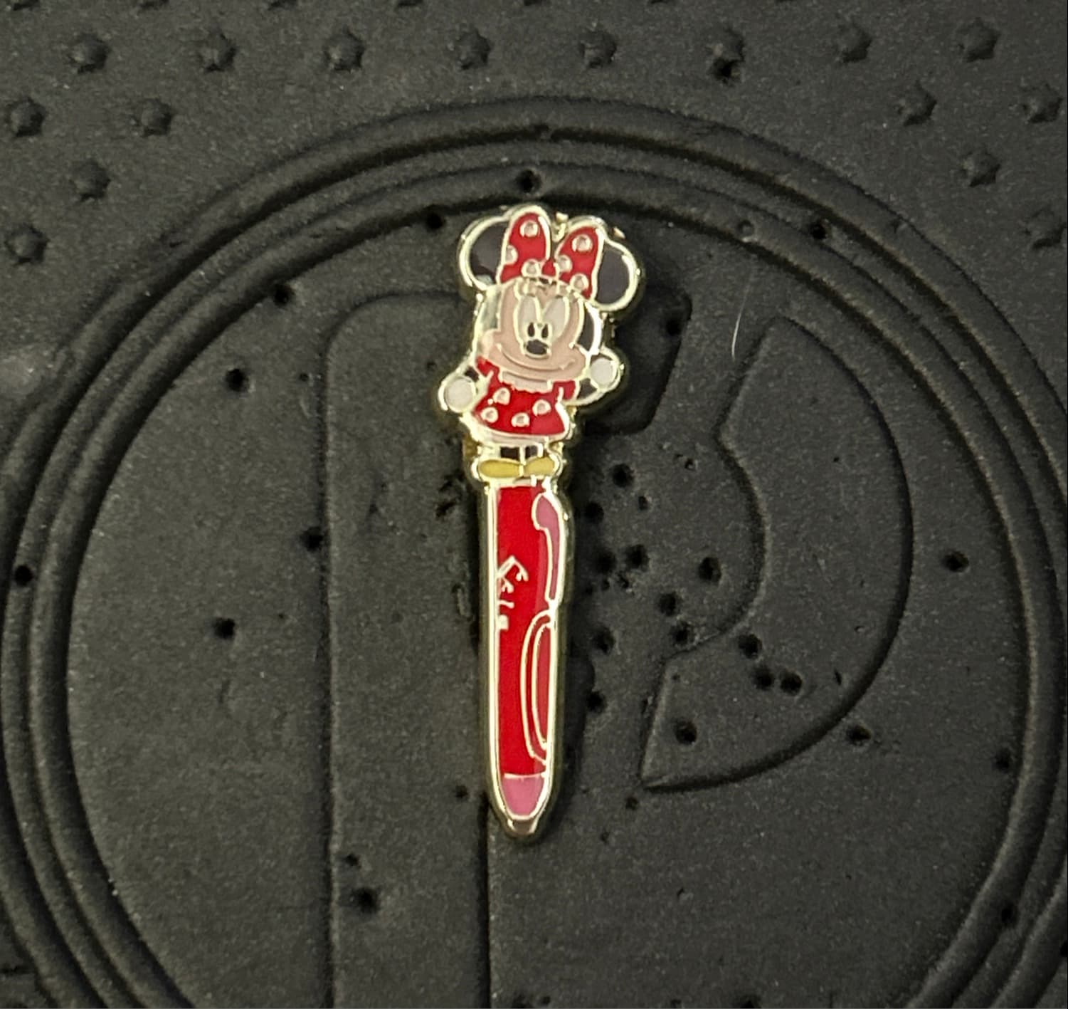 Minnie Mouse Standing with Red Pen 'Minnie' Text Pin front