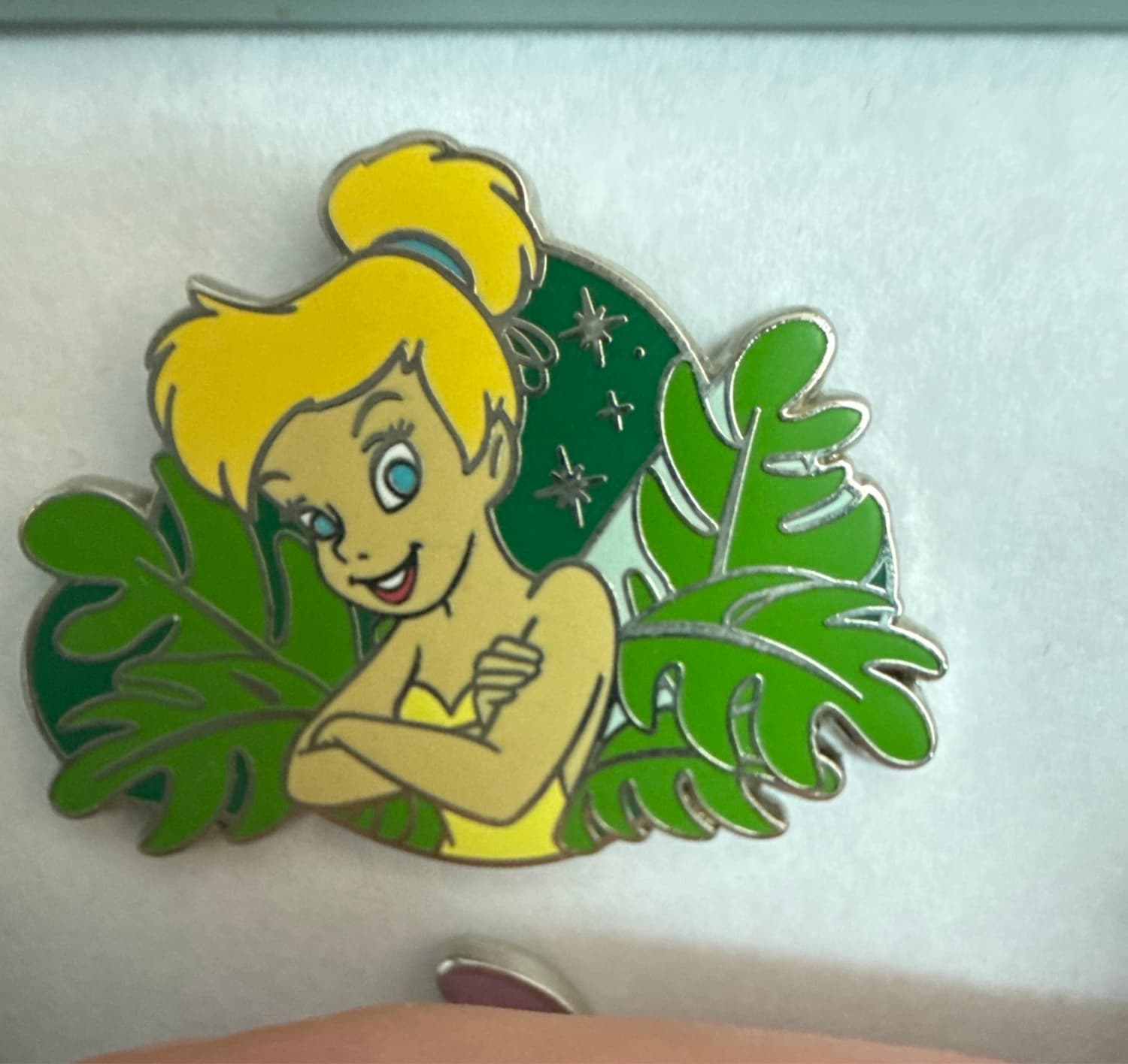 Tinker Bell with Arms Crossed in Leaves front