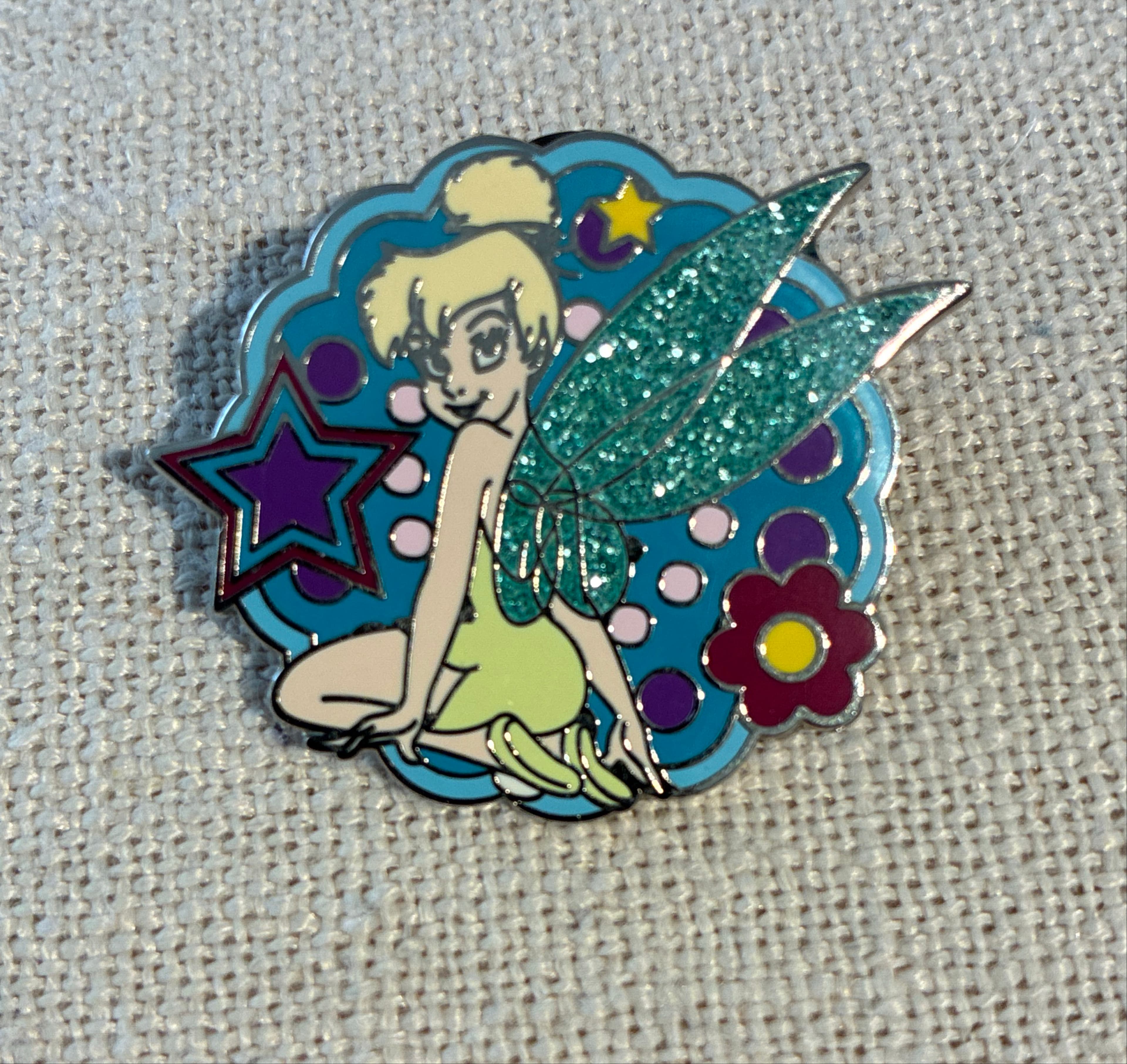 Tinker Bell Sitting with Glitter Wings, Stars, and Flower front