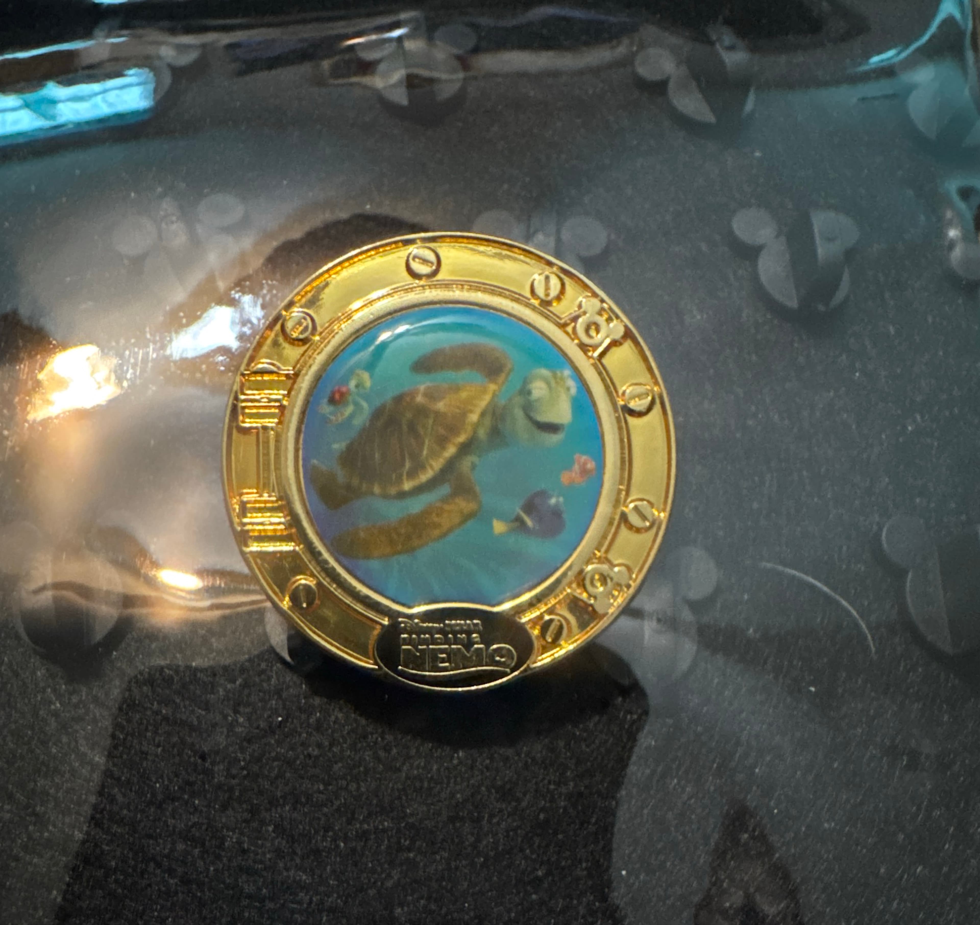 Crush, Dory, and Nemo/Marlin Gold Porthole Pin - Finding Nemo front
