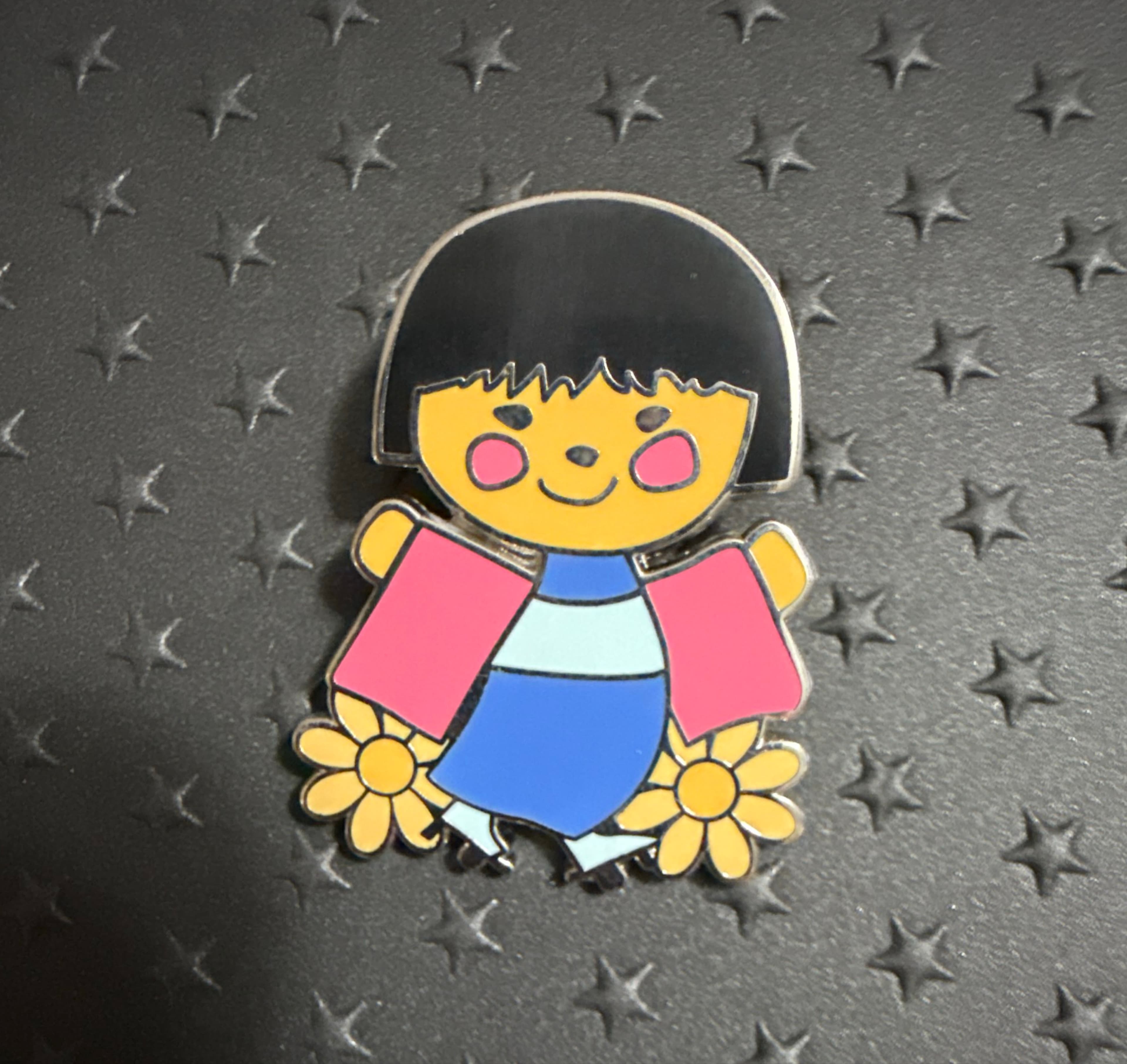 It's a Small World Girl Doll with Yellow Flowers front