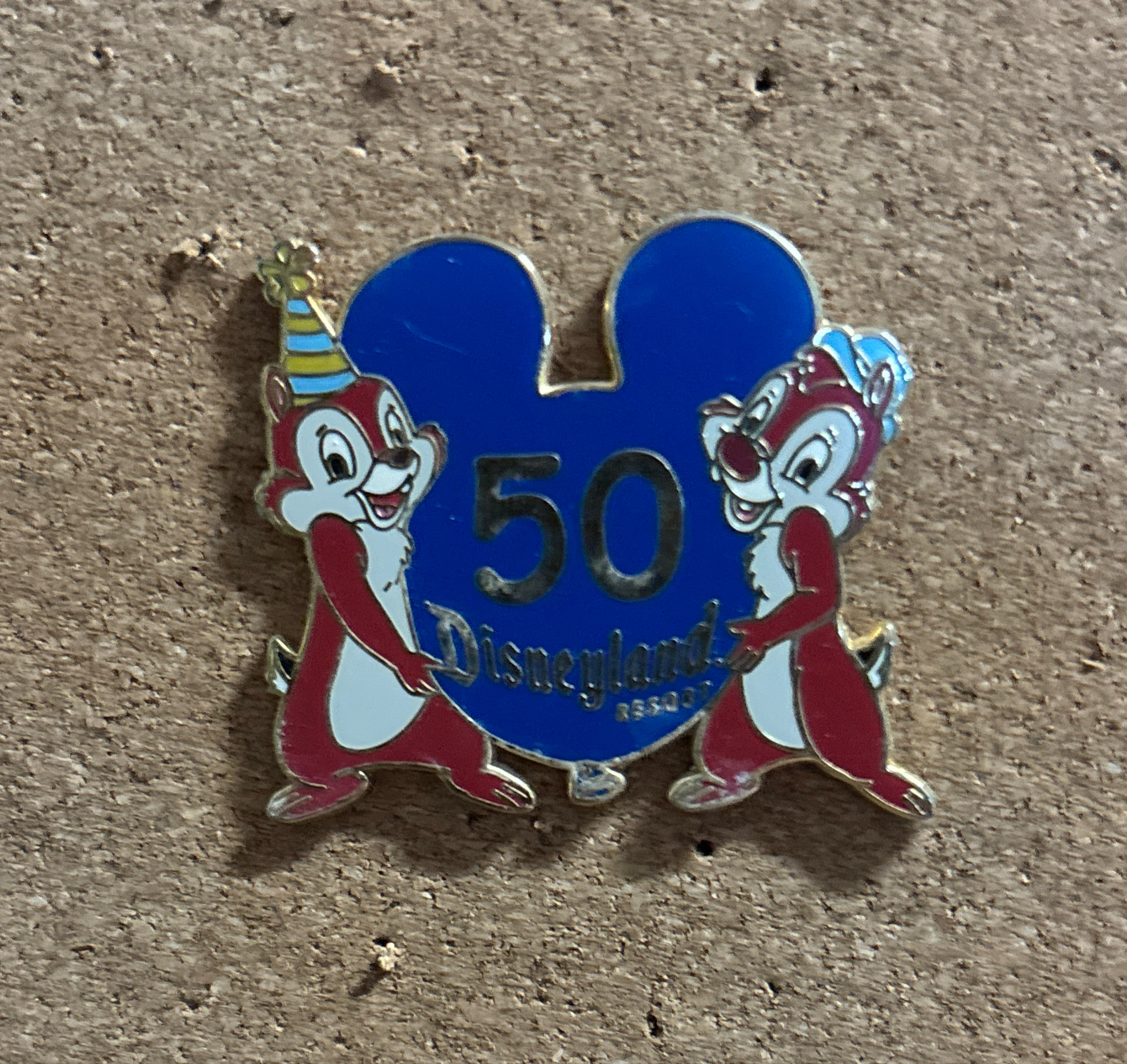 Chip and Dale holding 50th Anniversary Balloon - Disneyland Resort front