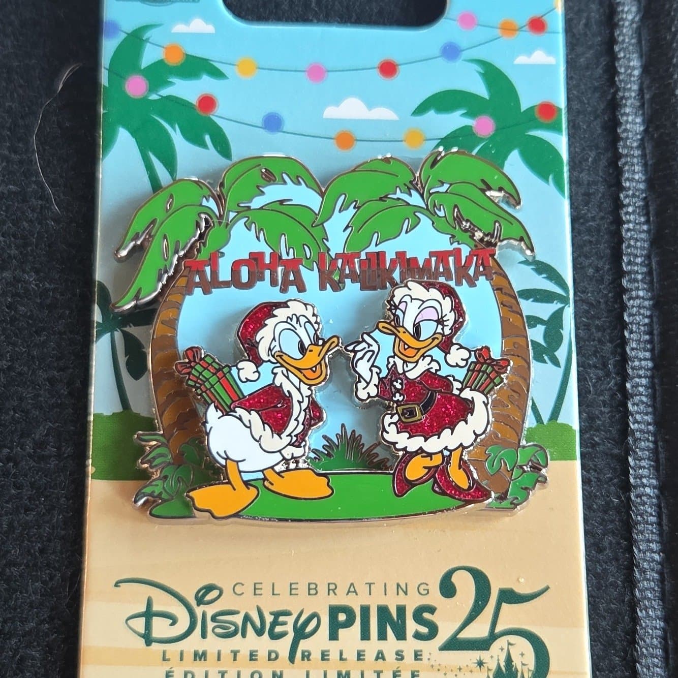 Donald and Daisy Duck Aloha Kalikimaka 2025 Holiday Pin front