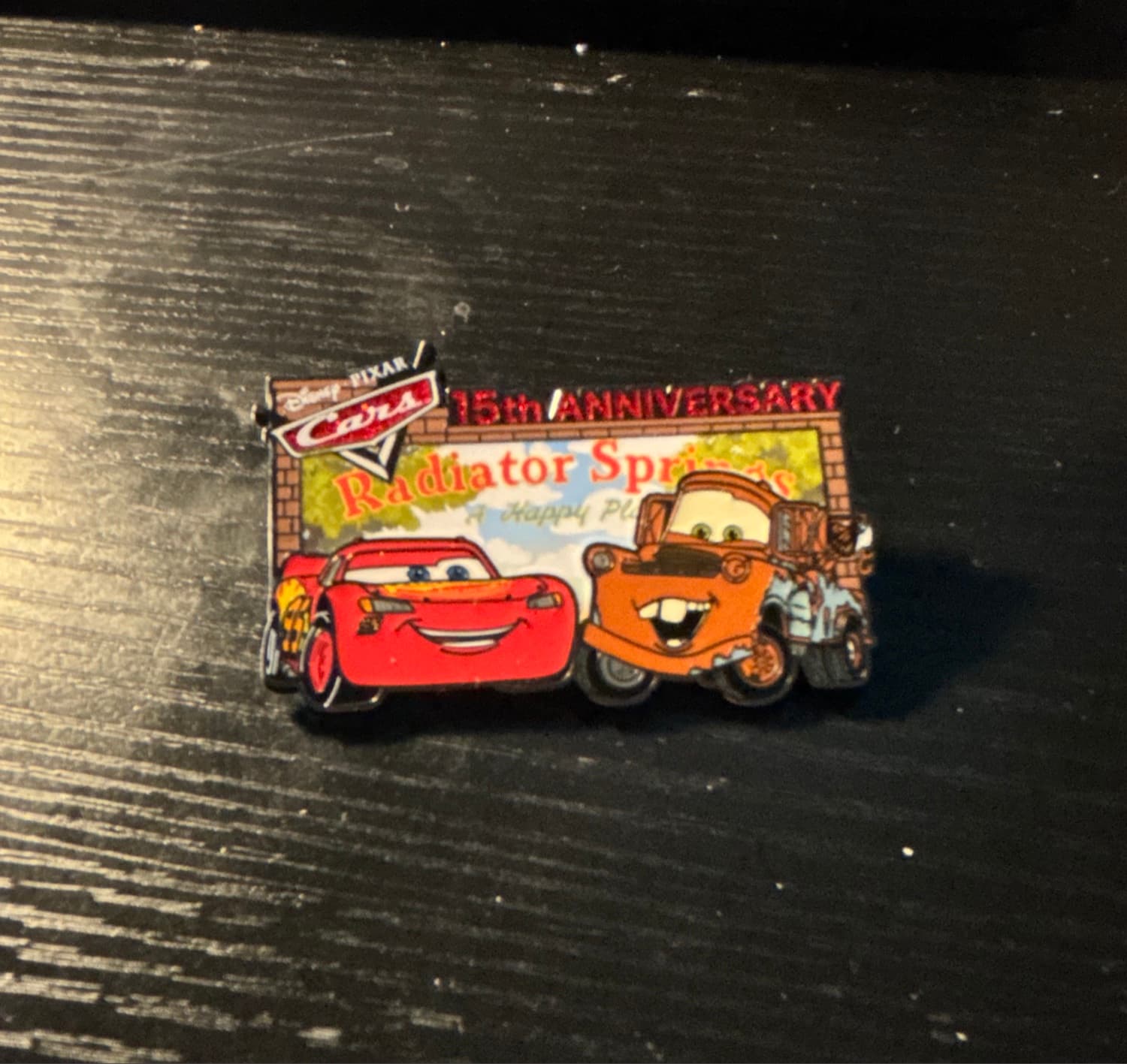 Lightning McQueen and Tow Mater in front of Radiator Springs Billboard - Cars 15th Anniversary front