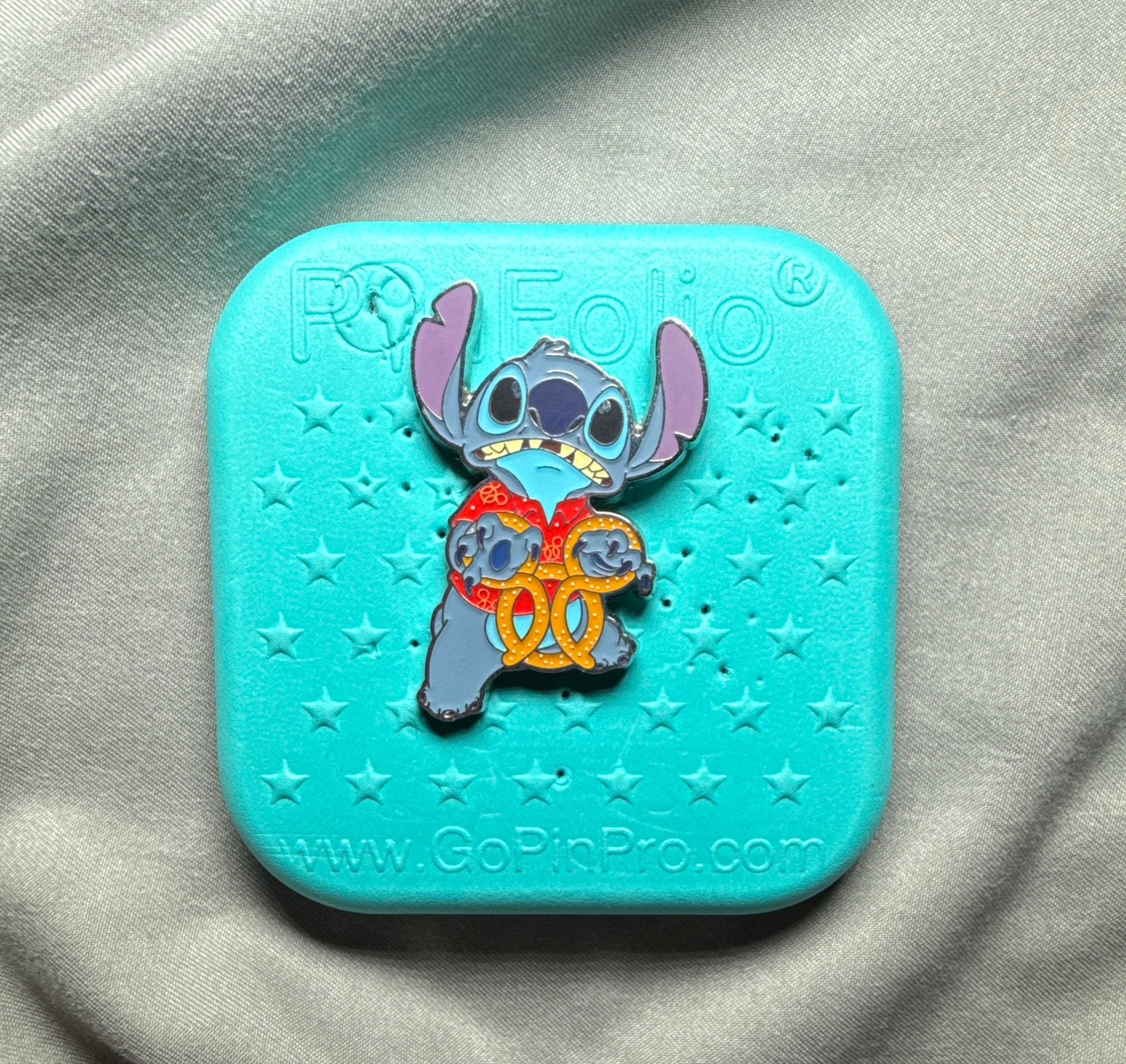 Stitch Holding Pretzel - Stitch Attacks Snacks Series - January front