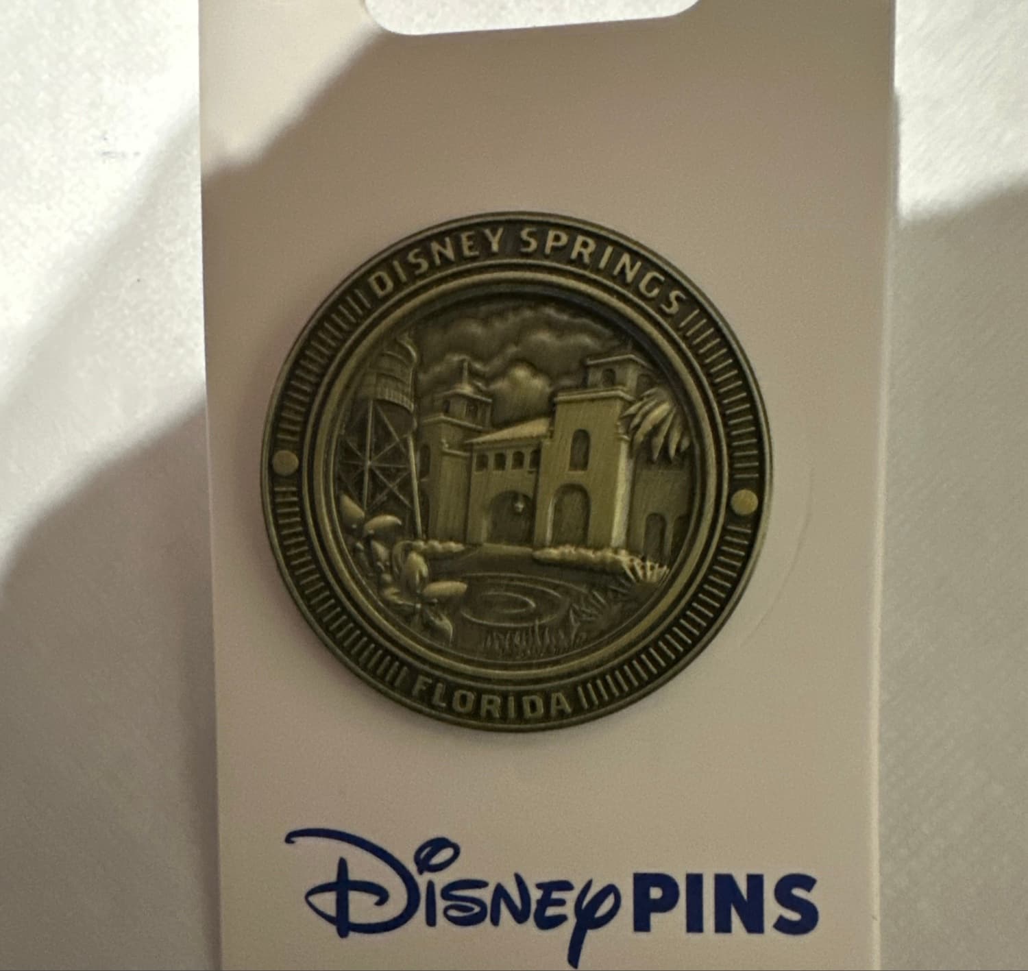 Disney Springs Bronze Coin Logo Town Center Florida Downtown Pin front