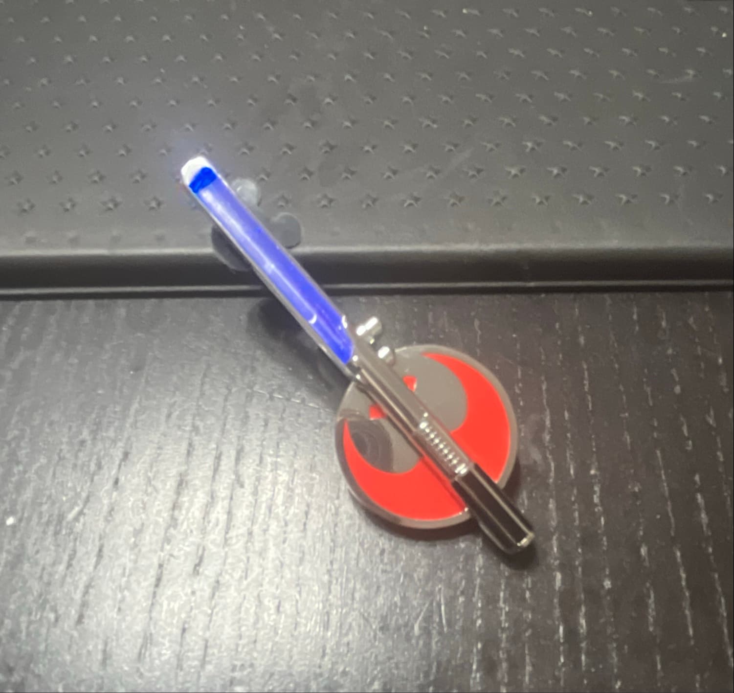 Star Wars Rebel Alliance Light-Up Blue Lightsaber Hilt Pin front