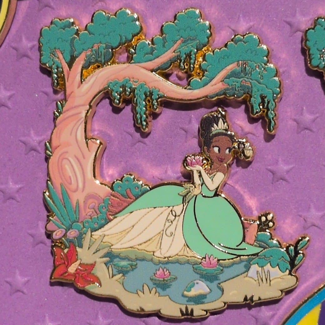 Princess Tiana Sitting with Lotus Flower by Tree and Pond Pin front