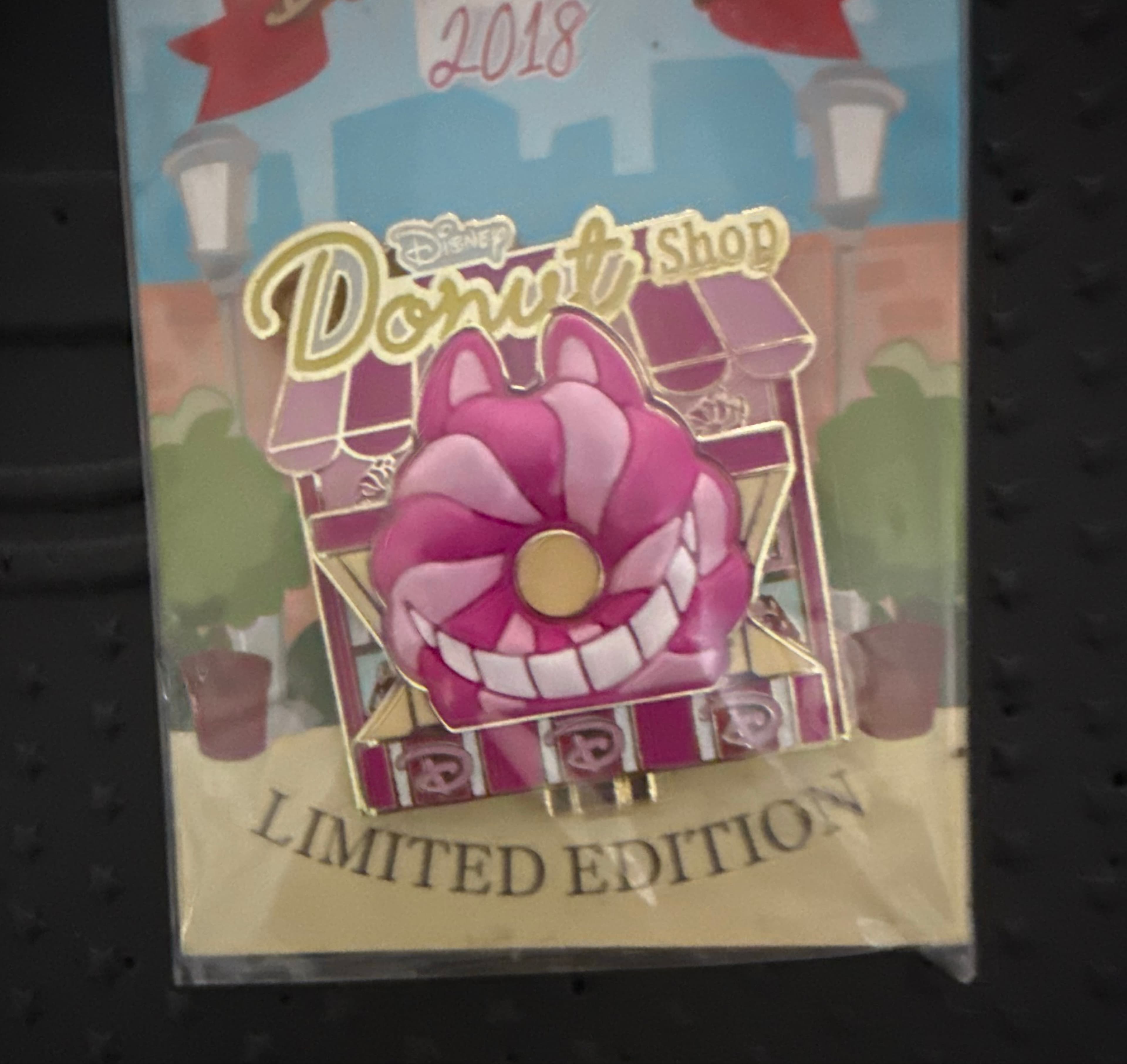 Cheshire Cat Donut Shop Pin of the Month front