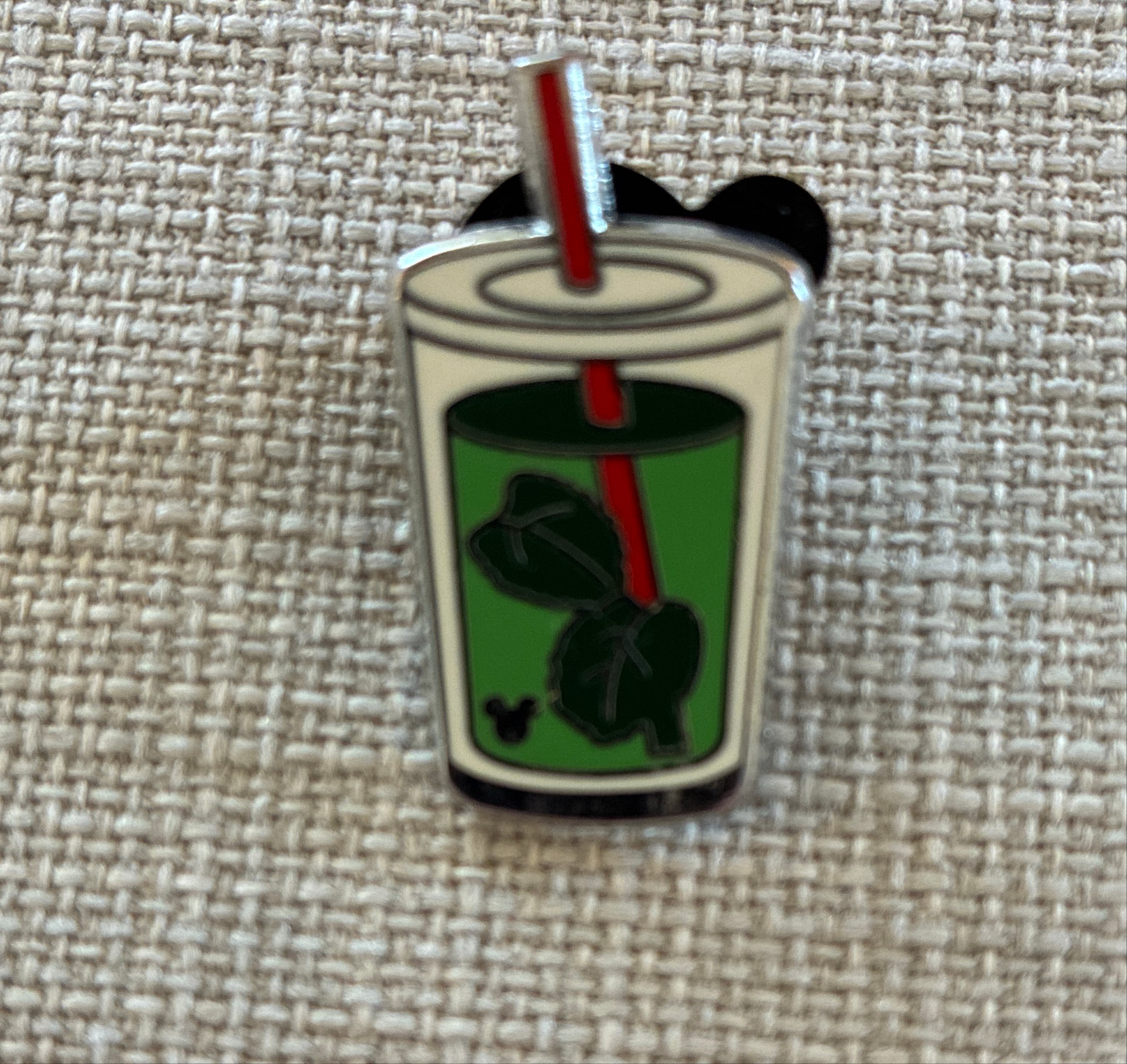 Hidden Mickey Green Tea Leaves Drink Cup Pin front