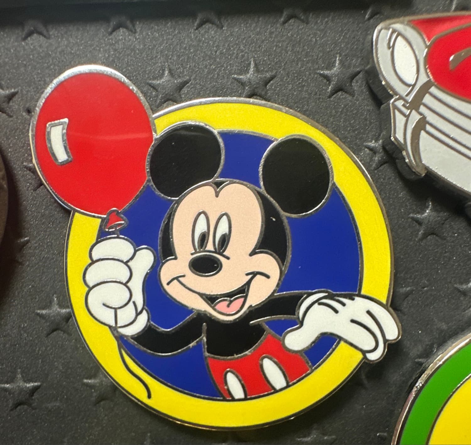 Mickey Mouse Holding Red Balloon in Blue and Yellow Circle front