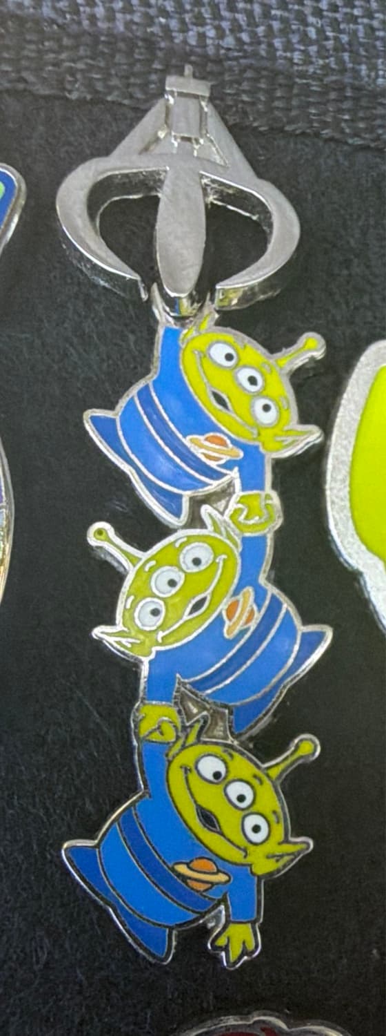 Toy Story 25th Anniversary - Little Green Men (LGMs) Hanging From the Claw front